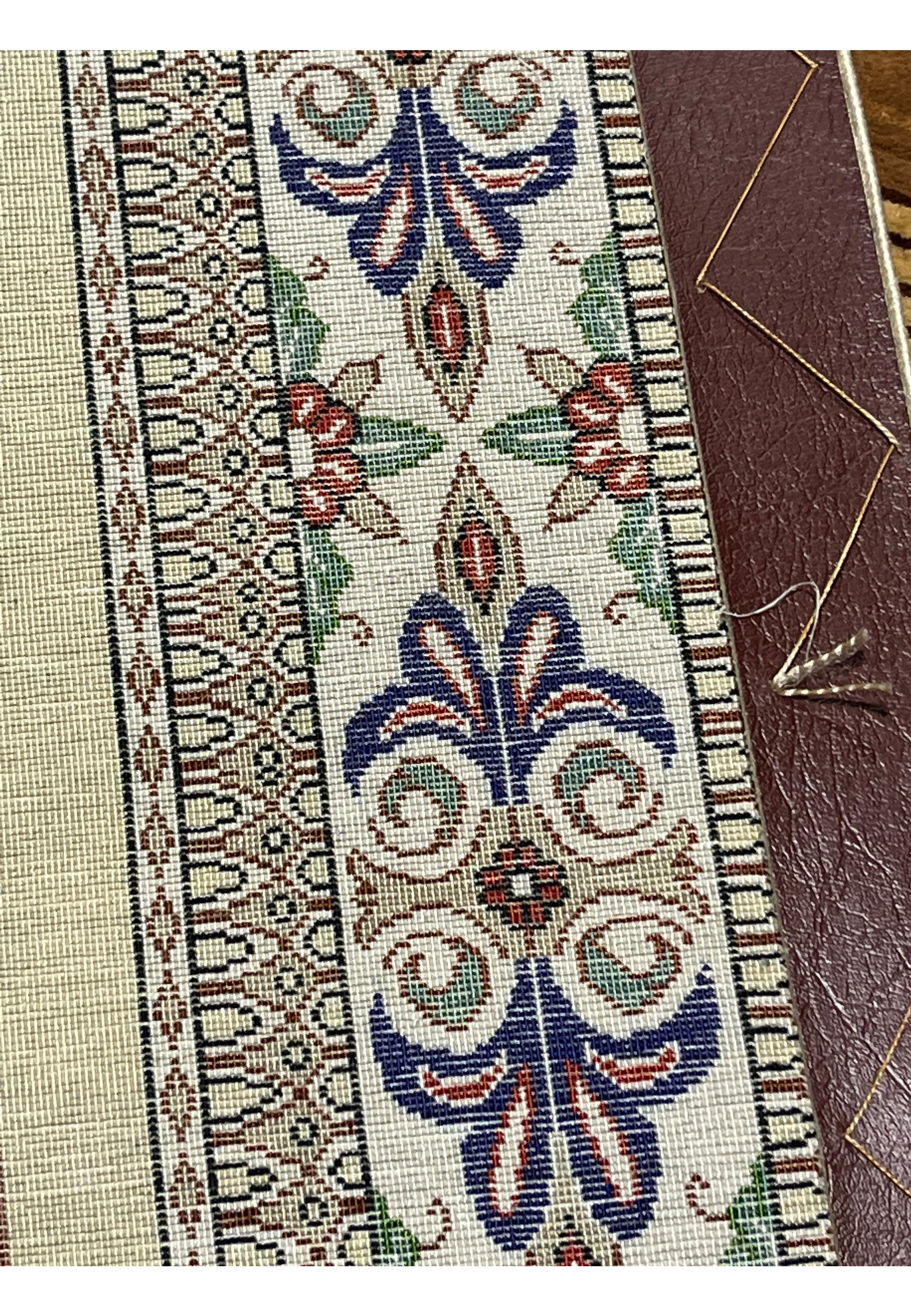Zoomed backside detail of signed Persian Qum silk rug showing tight knots, uniform weave, and high-quality silk foundation