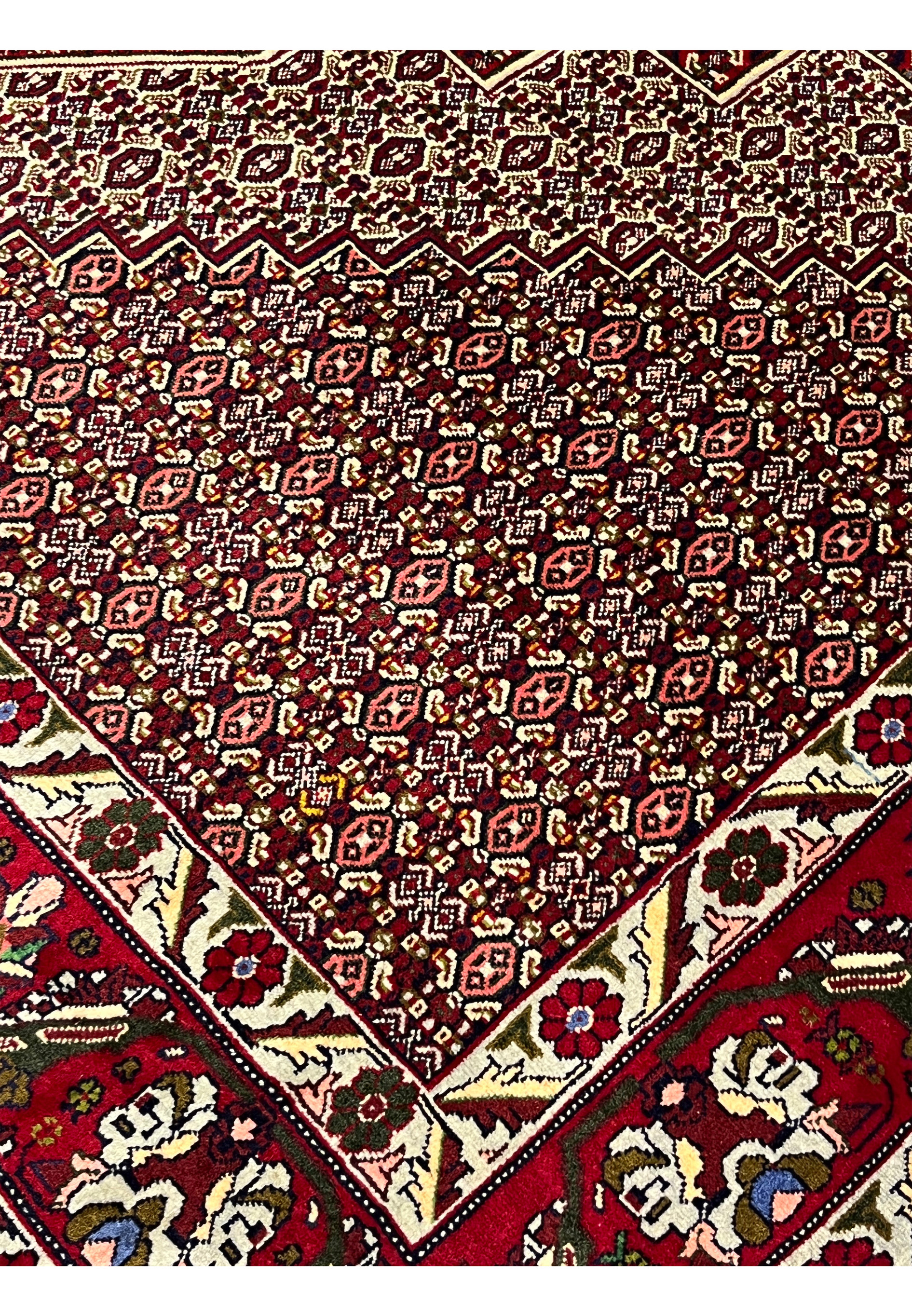 Inner border detail of Persian Senneh rug with geometric transitions, beige and ivory tones, and crisp linear articulation