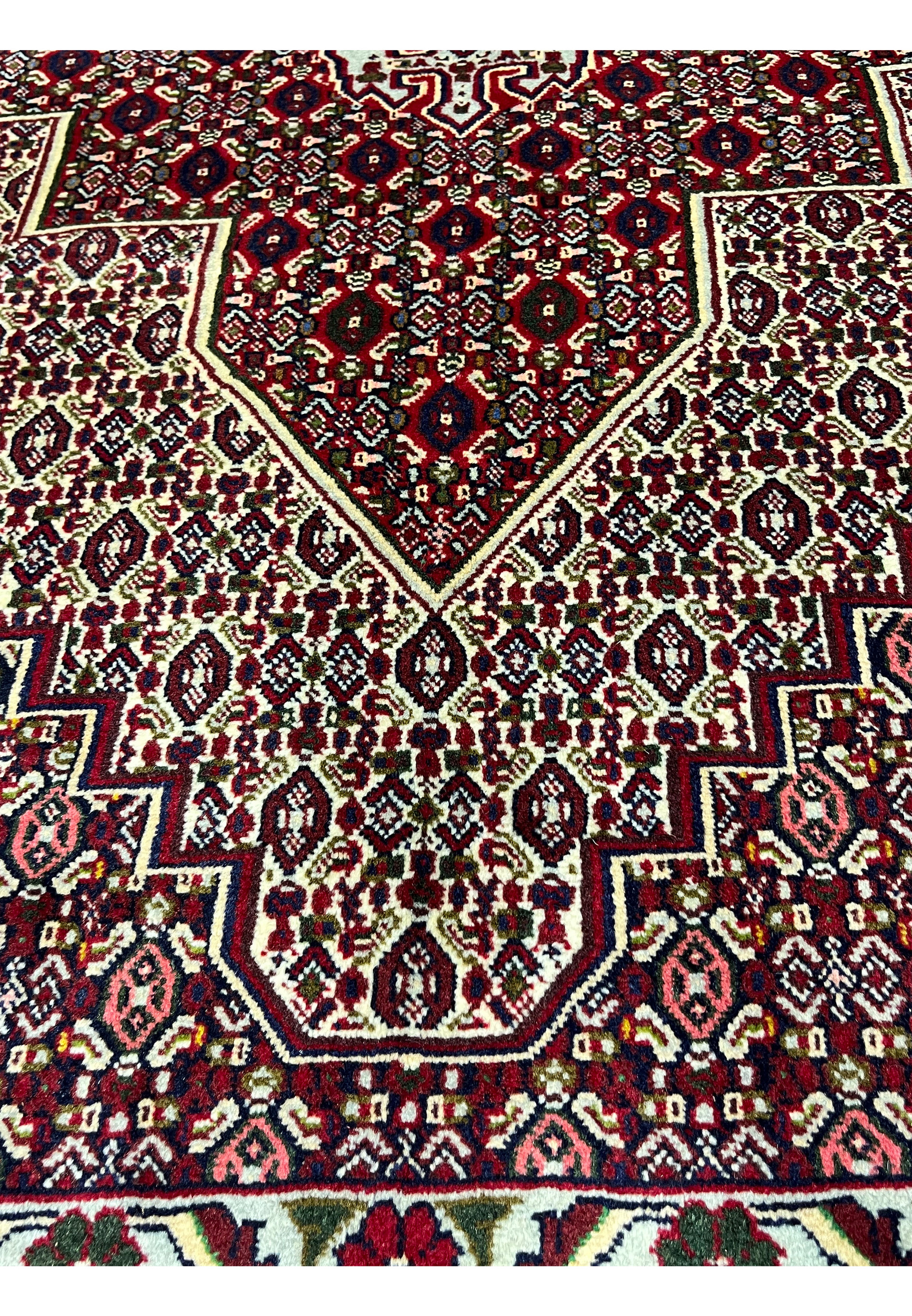 Face and foundation close-up of Persian Senneh rug revealing tight knot structure, clean weaving, precise color changes, and durable wool build