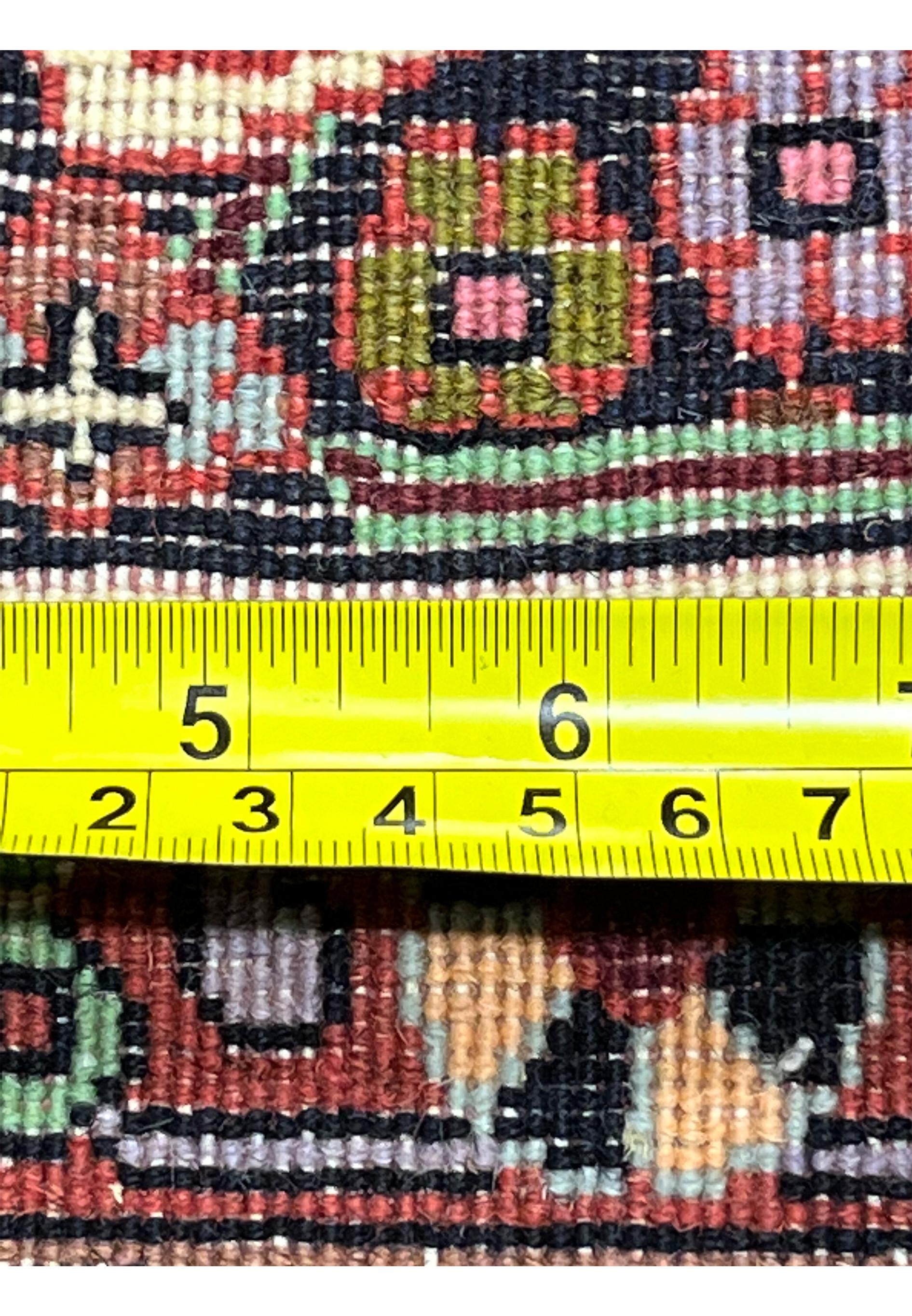 Backside close-up of Persian Bijar rug with ruler showing fine knot density, precise hand weaving, and compact construction typical of Bijar rugs.