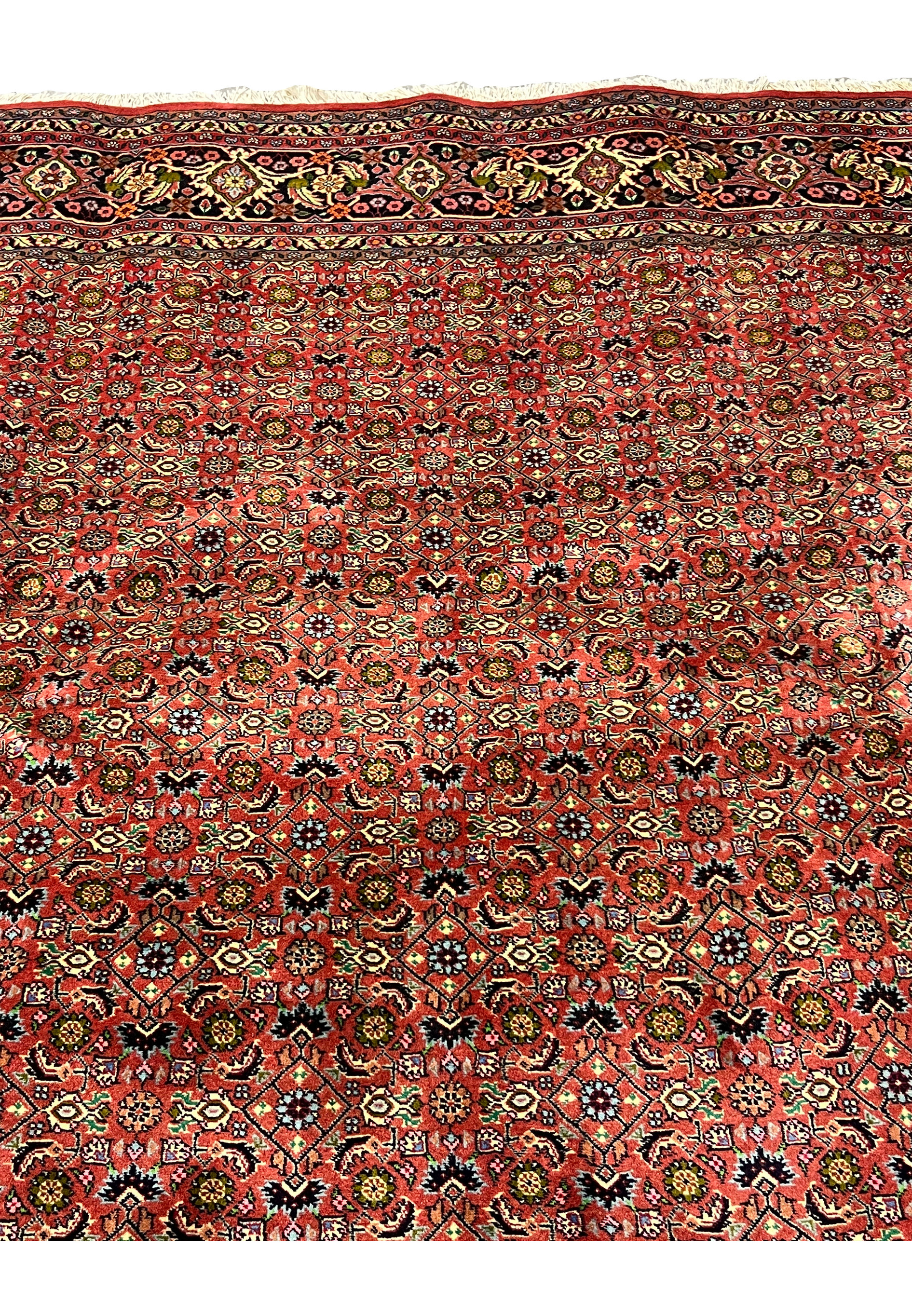Upper section of Persian Bijar rug showing consistent weave density and harmonious color distribution