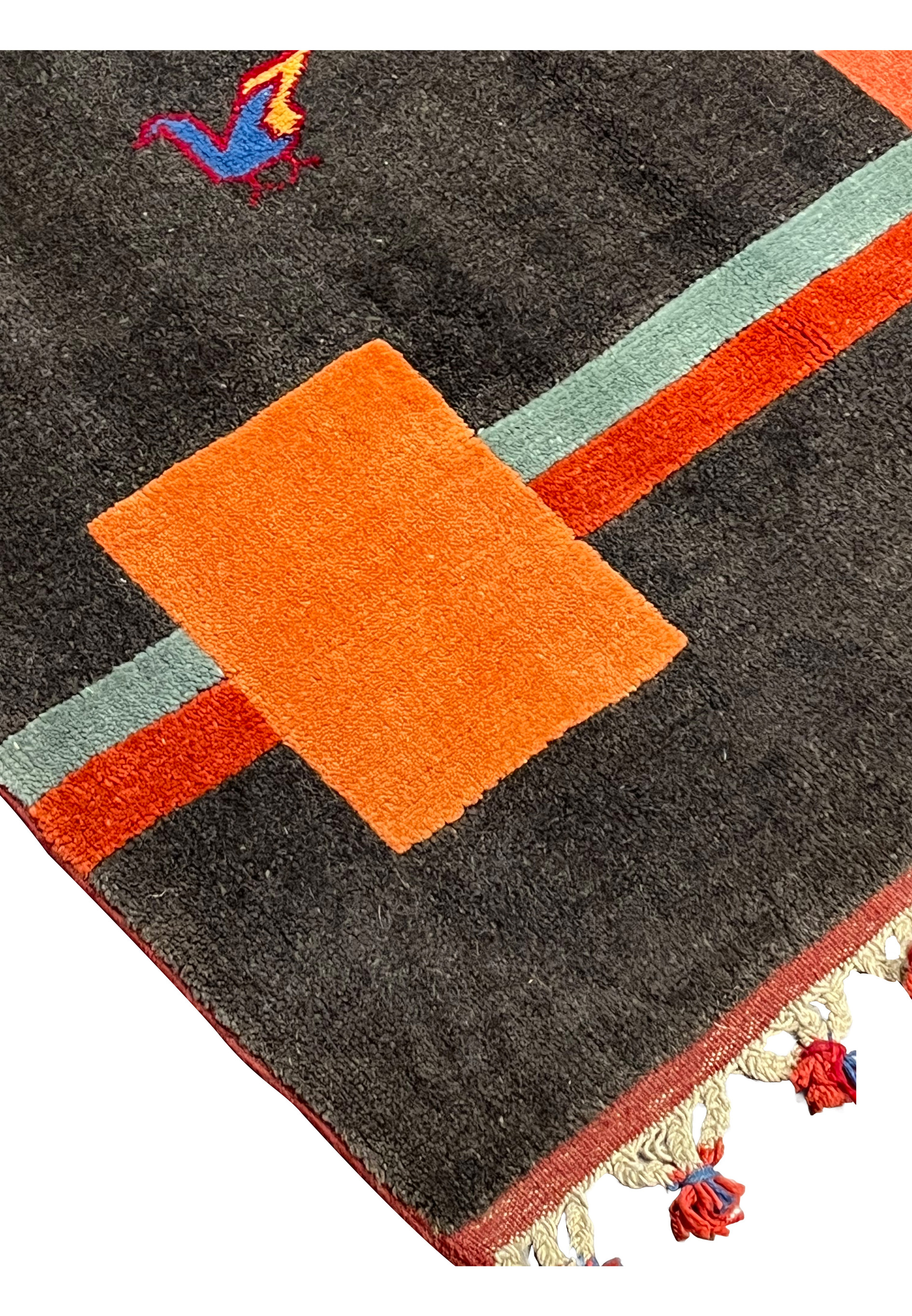 Edge detail of Persian Gabbeh rug displaying clean finishing, sturdy binding, and plush wool pile construction