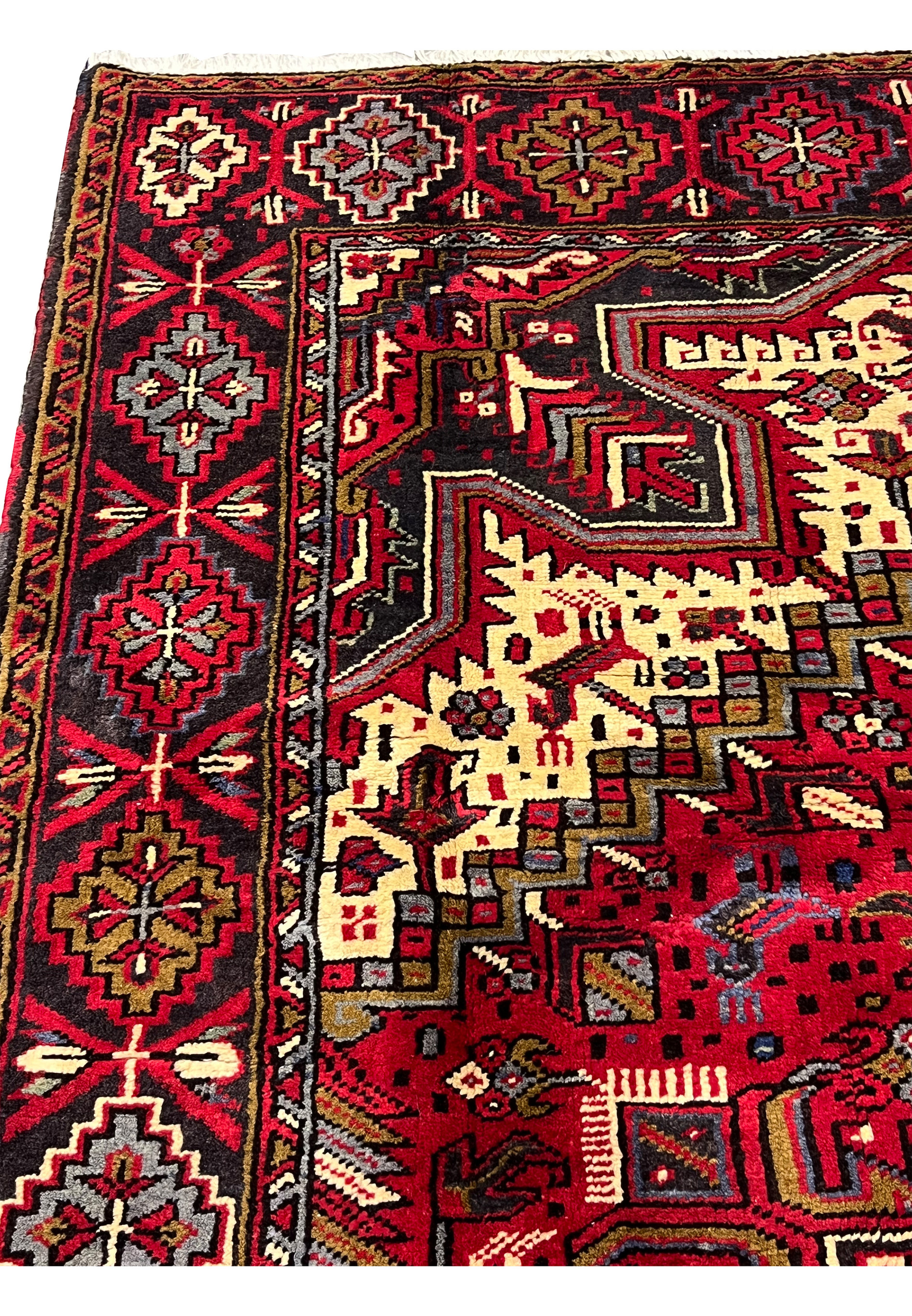 Top edge and fringe area of hand knotted Persian Heriz rug showing selvage binding, clean finishing and durable wool construction with crisp details
