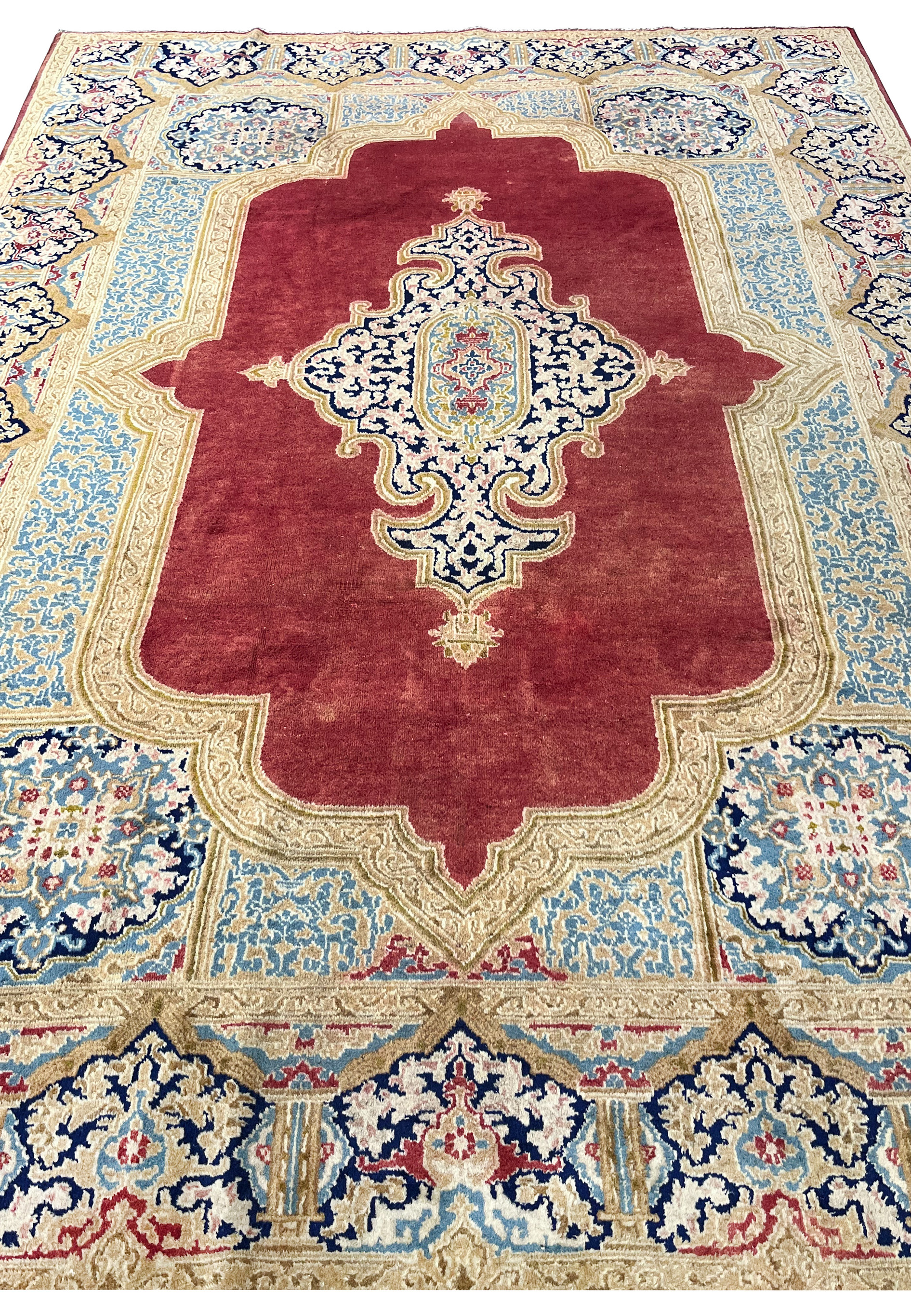 Top view antique Kerman carpet showing full border layout floral panels sky blue compartments ivory frame hand knotted wool