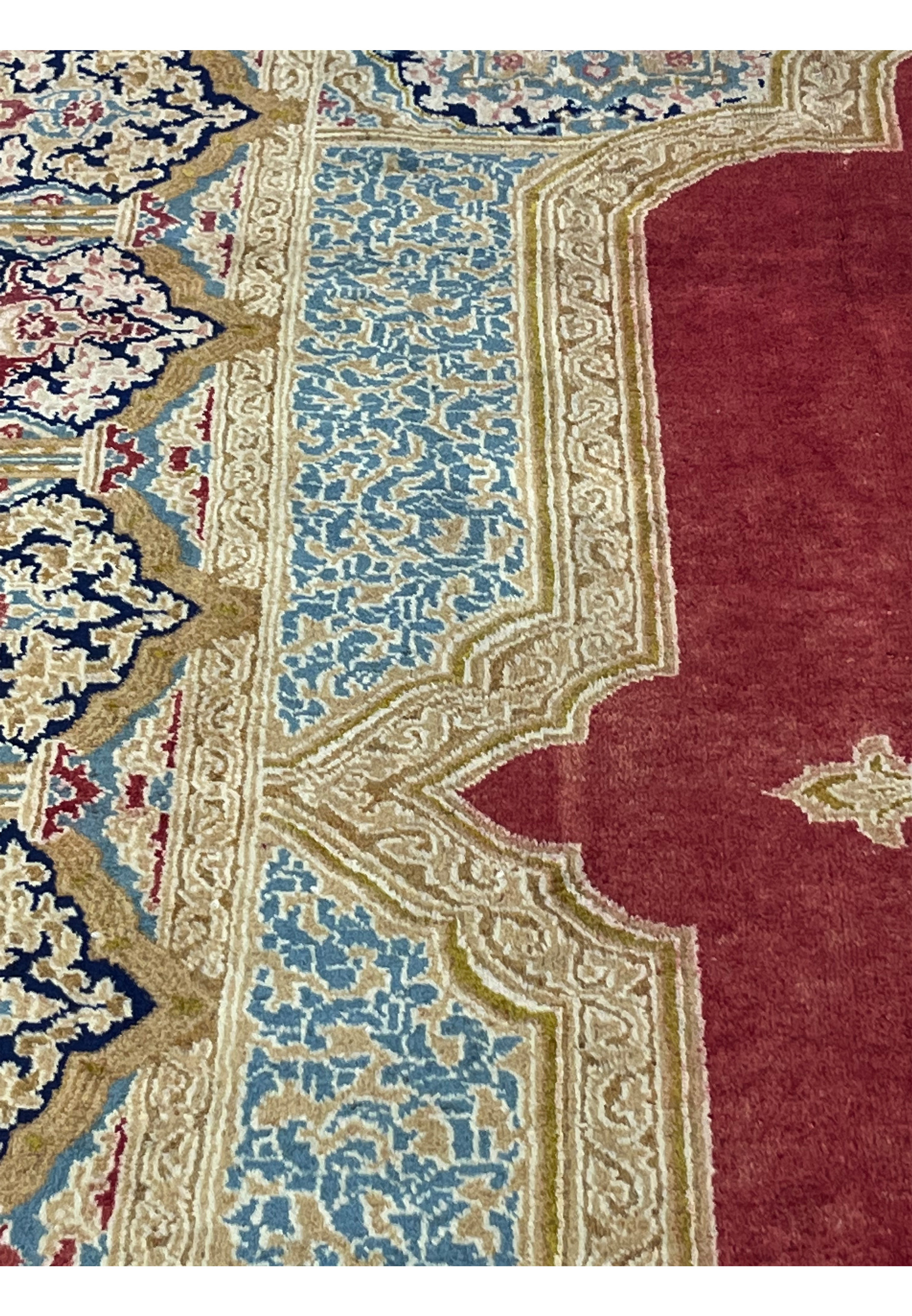 Side profile of handmade Persian Kerman rug displaying medium wool pile height, dense knots and crisp border definition