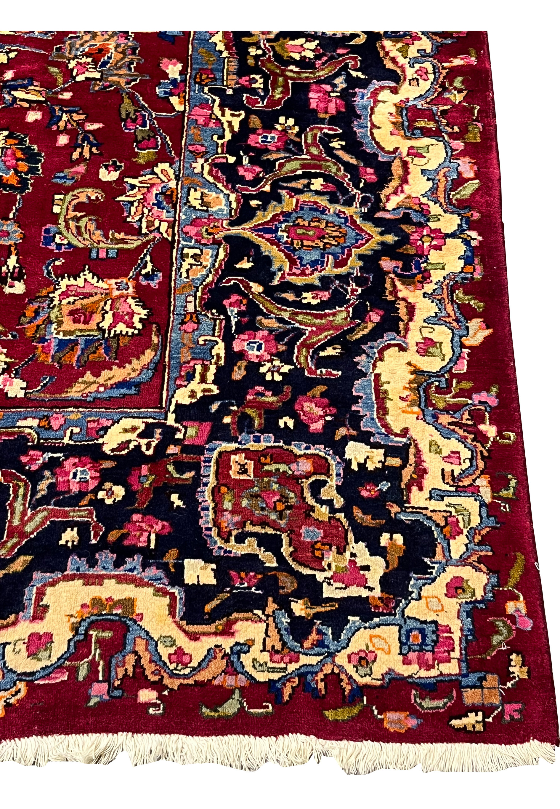 Border detail showing layered guard borders, floral scrollwork, and classic Mashad design structure in rich contrasting tones