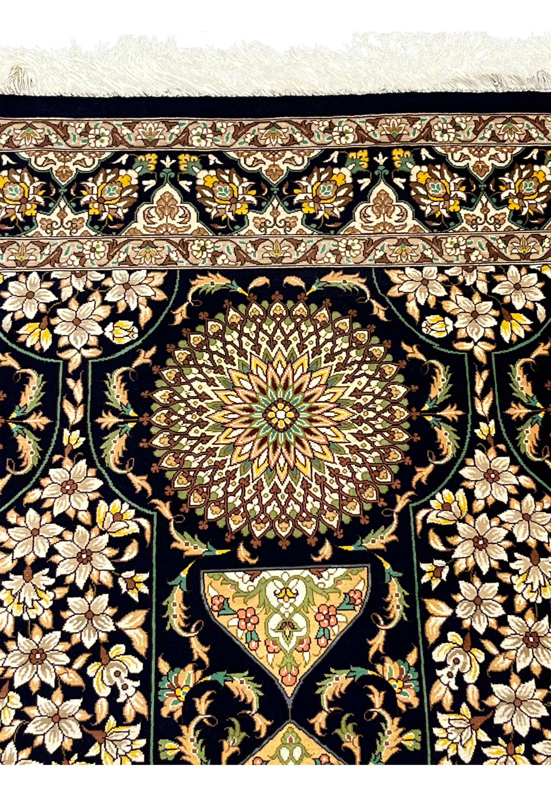 Top border and fringe detail showing signature area ivory tassels and ornate floral band on navy silk Persian Qum handmade rug