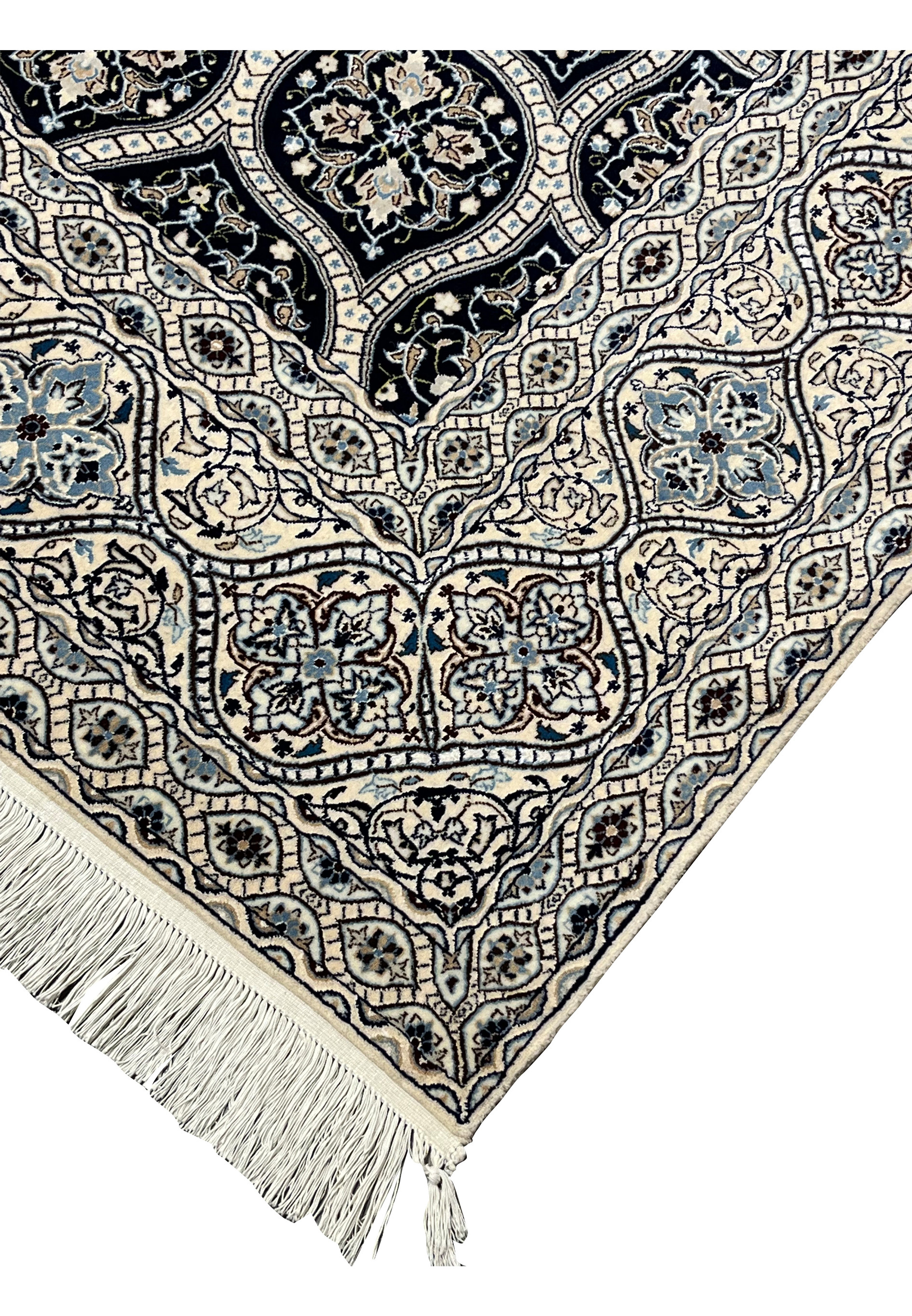 Edge detail of Persian Nain 6 LA rug showing tight knot density cotton foundation and ivory fringe finish.