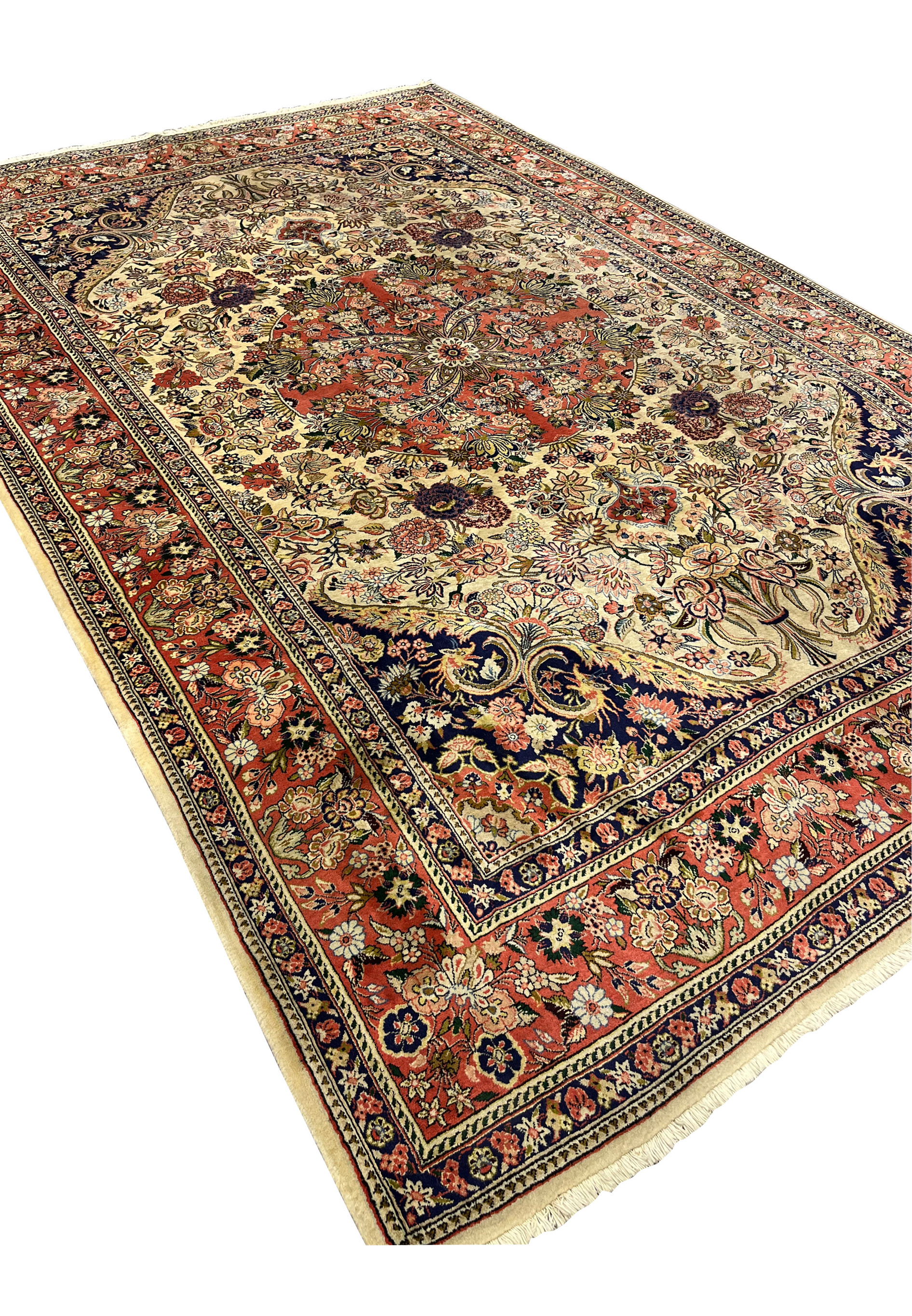 7x10 Persian Bijar rug angled view showing ivory field coral medallion navy spandrels and dense floral border