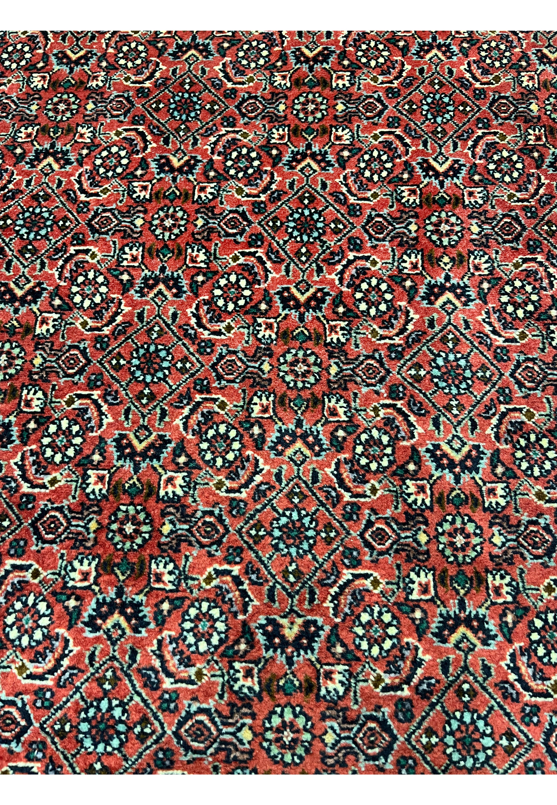 Detailed patterns and motifs of 8'2 x 11'4 Persian Bijar Iron Rug showing compact geometric floral design in red, ivory and navy tones