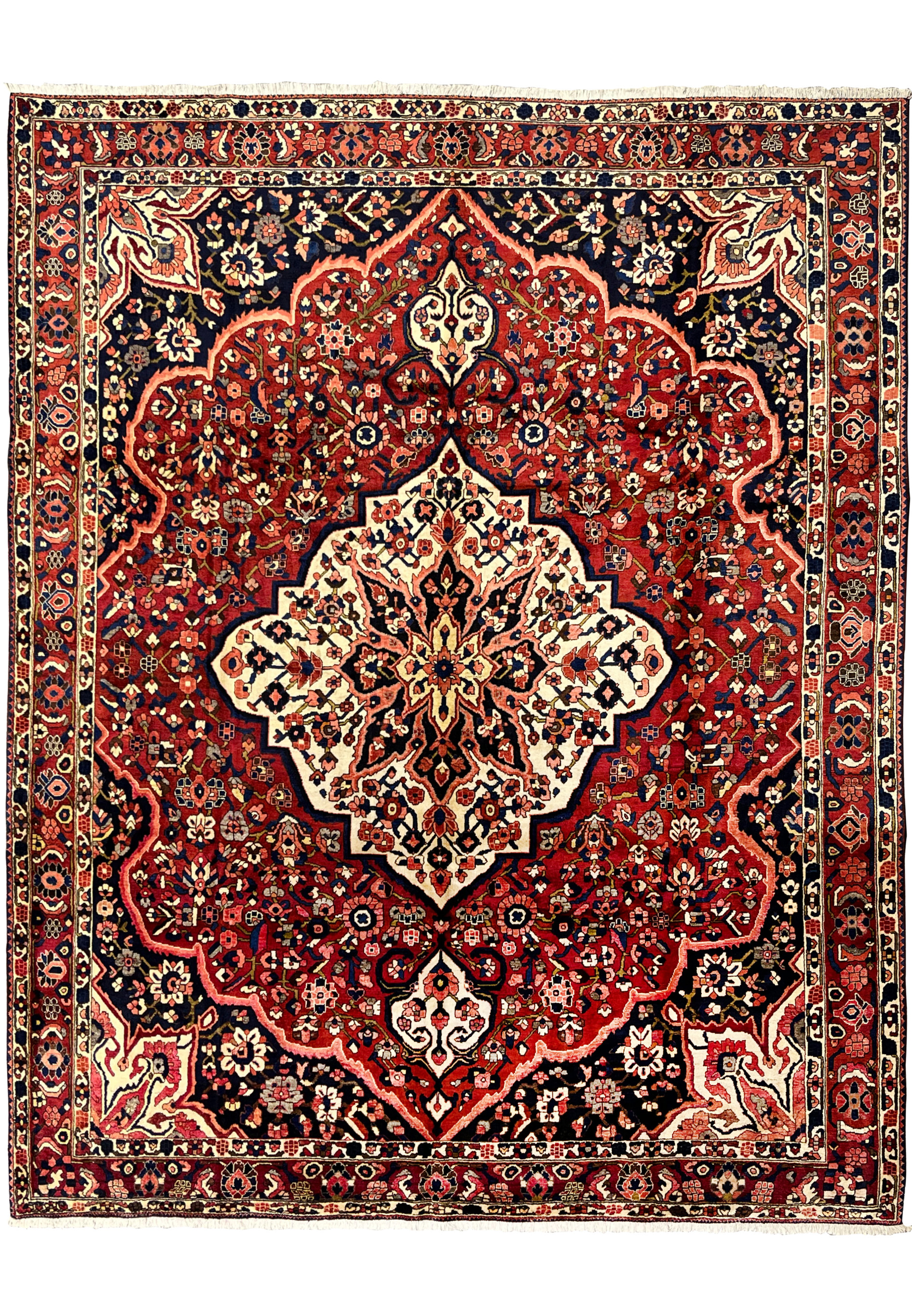 Vintage Persian Bakhtiari rug 10x14 full view, hand-knotted wool with crimson red field and ivory star medallion.