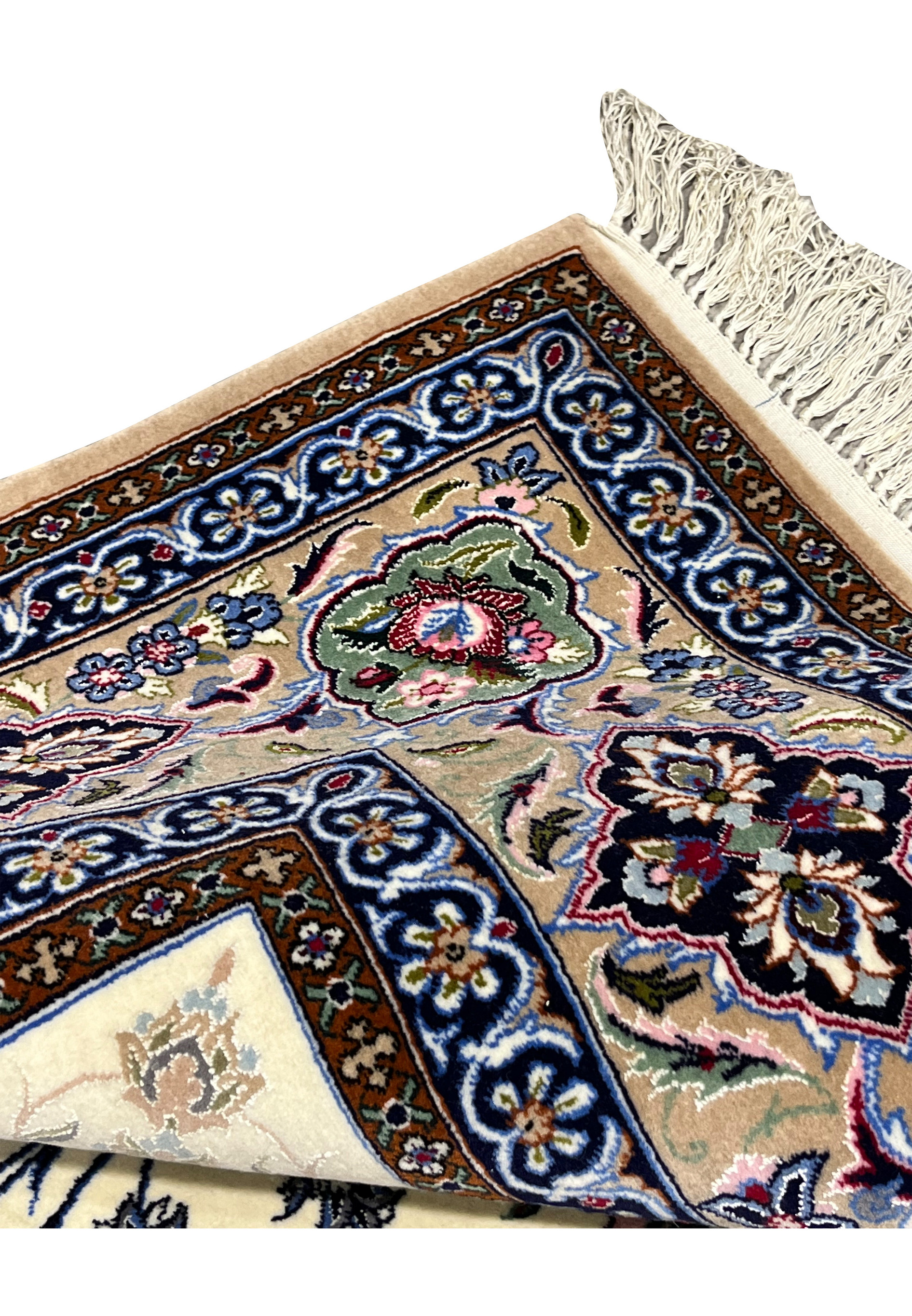 Folded edge detail Persian Isfahan wool silk rug showing hand knotted construction taupe border ivory fringe