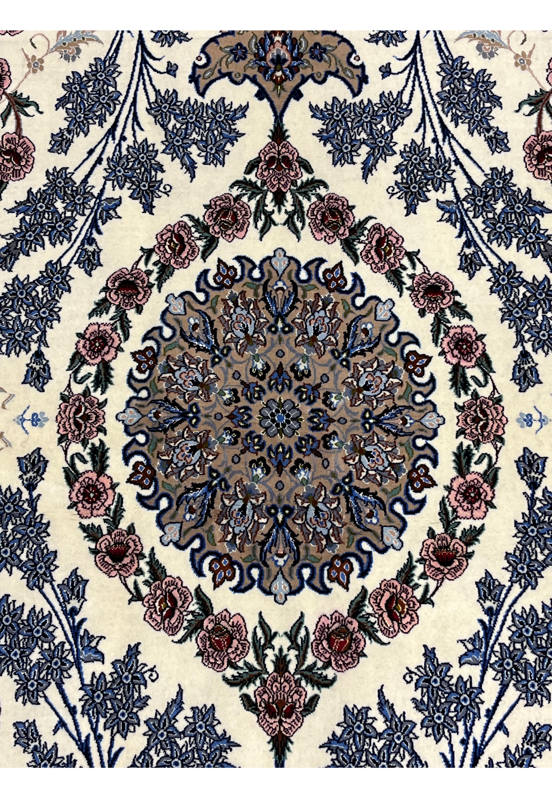 Closeup central medallion Persian Isfahan wool silk rug taupe golden ground blue arabesque scrollwork pink roses