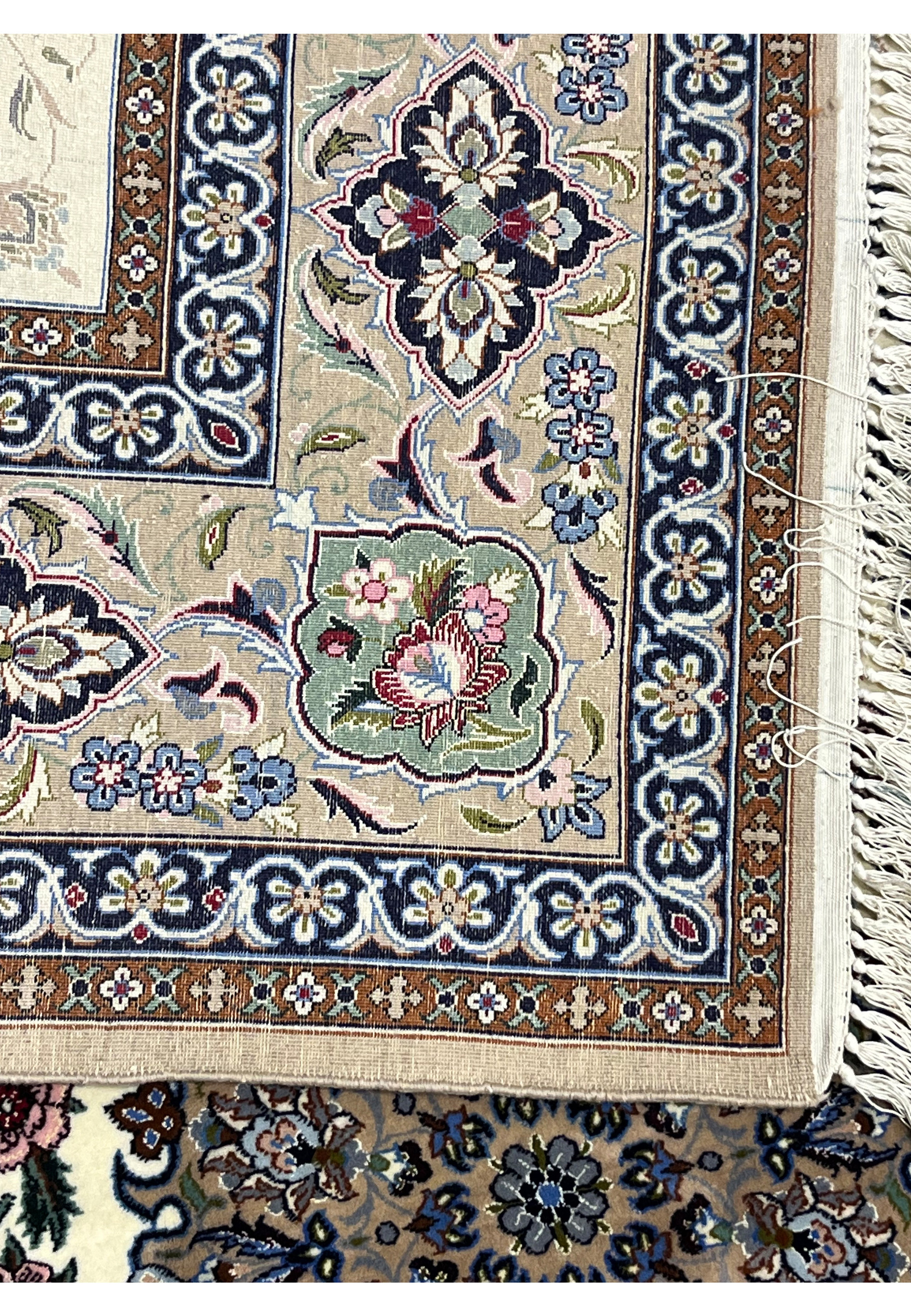 Backside Persian Isfahan wool silk rug showing hand knotted cotton foundation crisp floral pattern Darri signed
