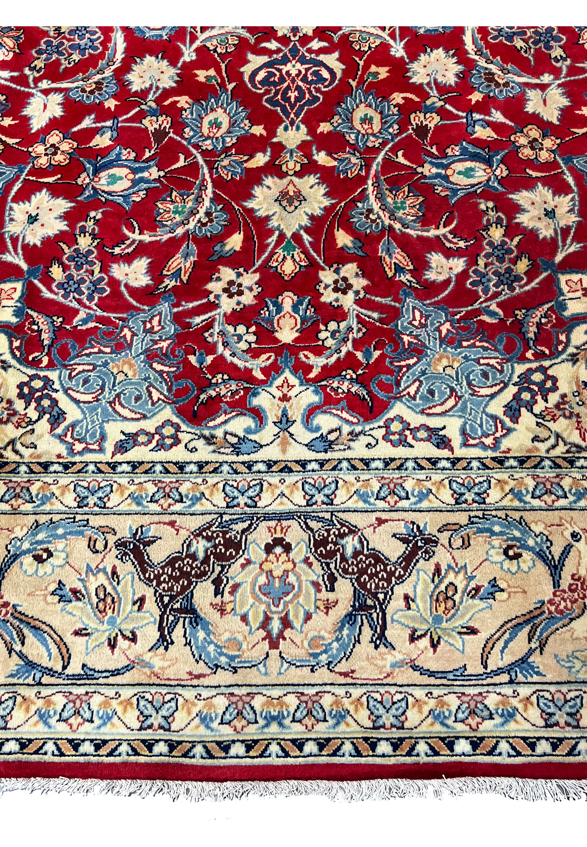 Lower border 10x13 Persian Isfahan wool rug facing deer animal pair on ivory ground blue floral surround crimson field.