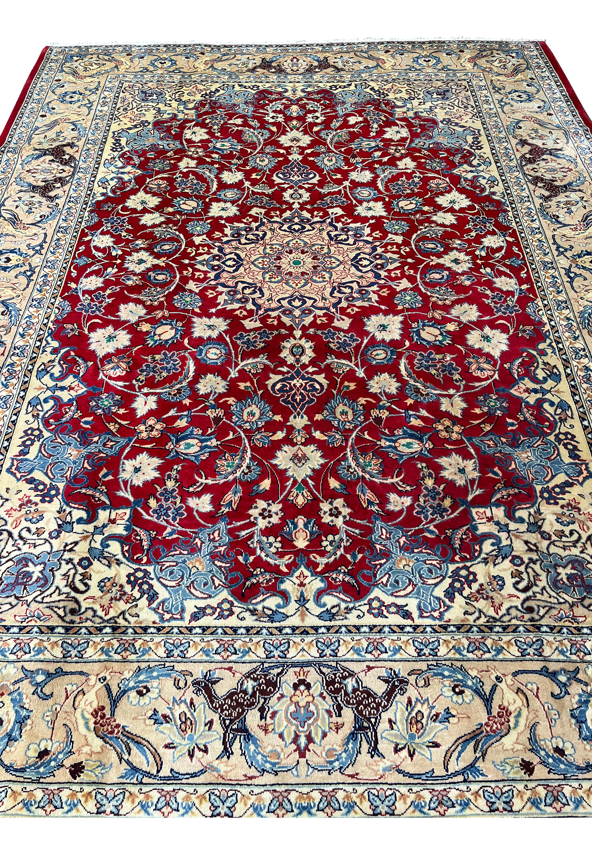 Midfield view 10x13 Persian Isfahan wool rug crimson red field ivory floral arabesques blue scrollwork animal border