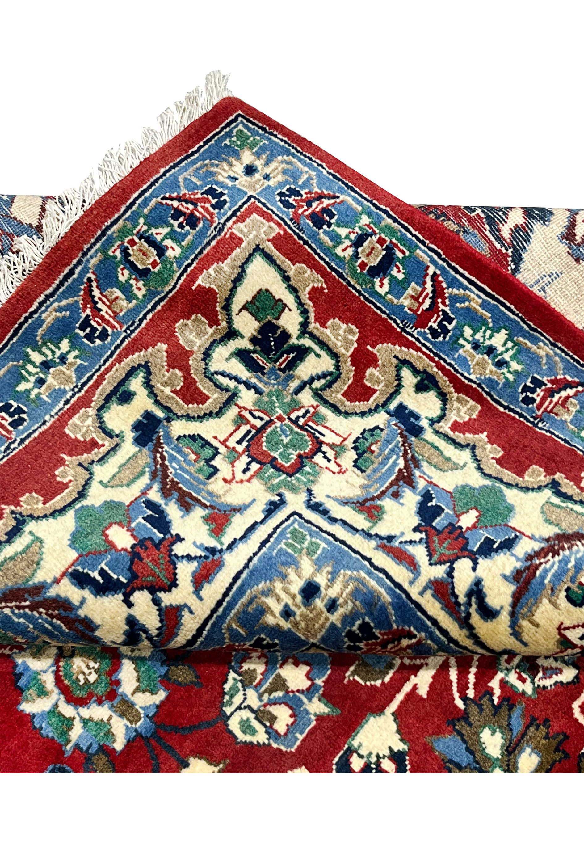 Folded edge detail 8x12 Persian Isfahan wool rug showing hand knotted construction pile depth ivory border crimson field