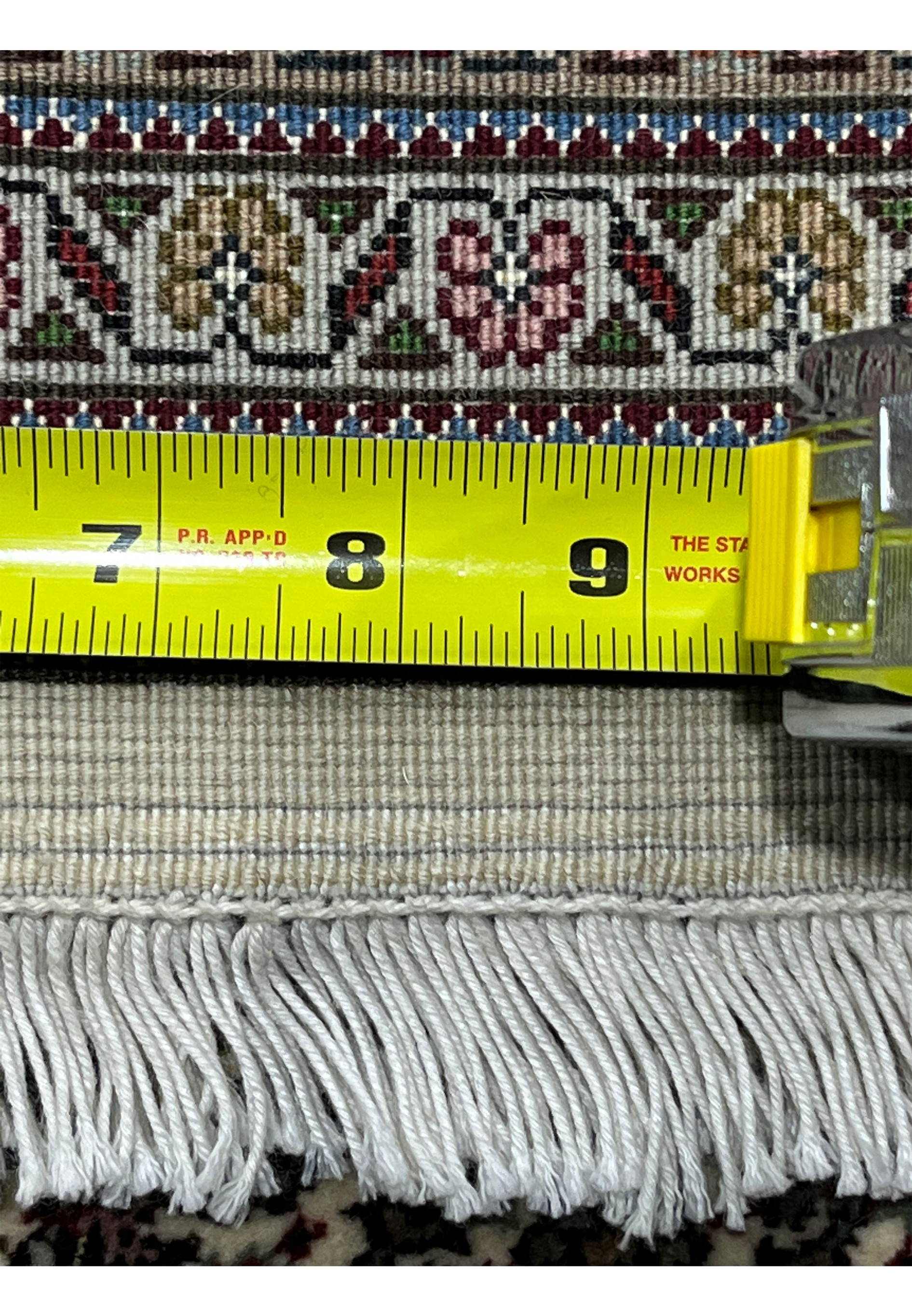 Backside with ruler Persian Tabriz Mahi 50 Raj wool silk rug measuring fine knot density hand knotted construction