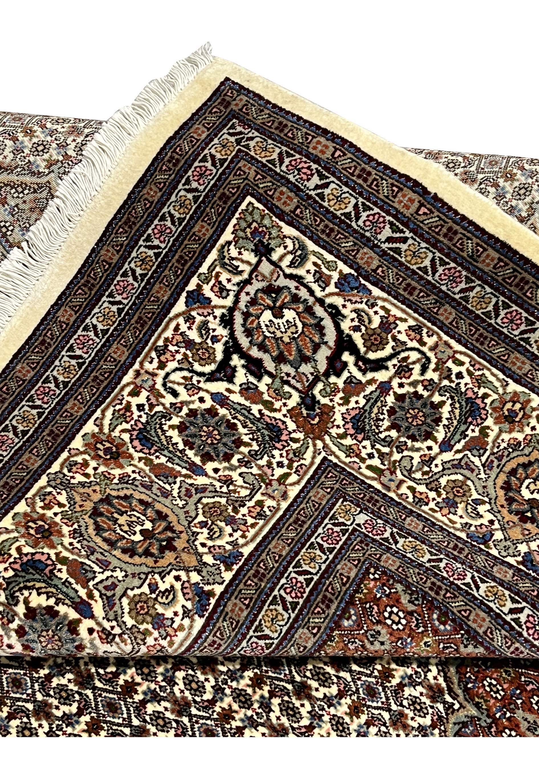 Folded edge Persian Tabriz Mahi 50 Raj wool silk rug showing hand knotted construction pile depth ivory border