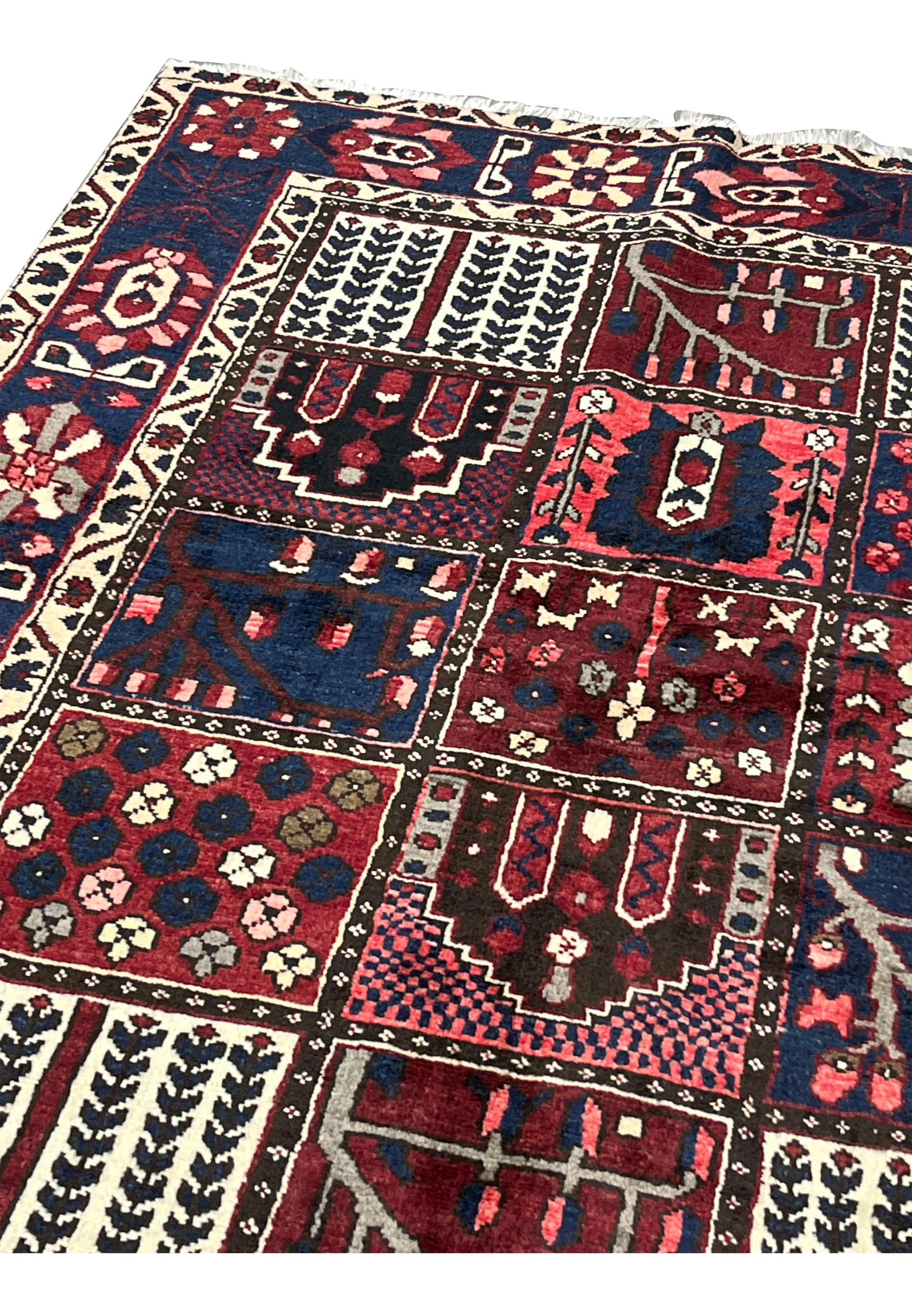 Upper edge and ivory fringe detail of 7x10 hand-knotted Persian Bakhtiari panel rug