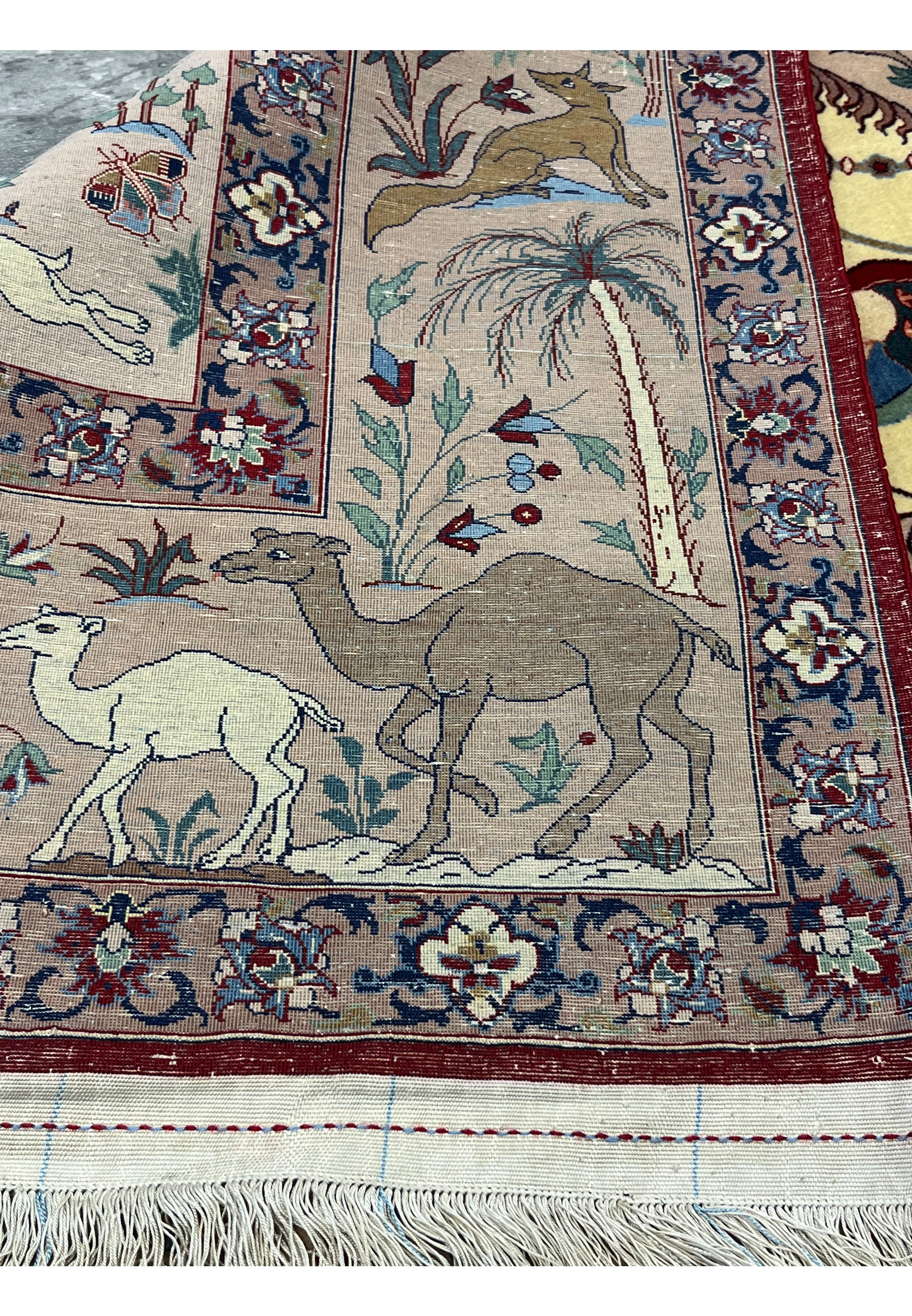 Back side of 5x8 fine Persian Isfahan Seirafian rug showing silk foundation and knot density