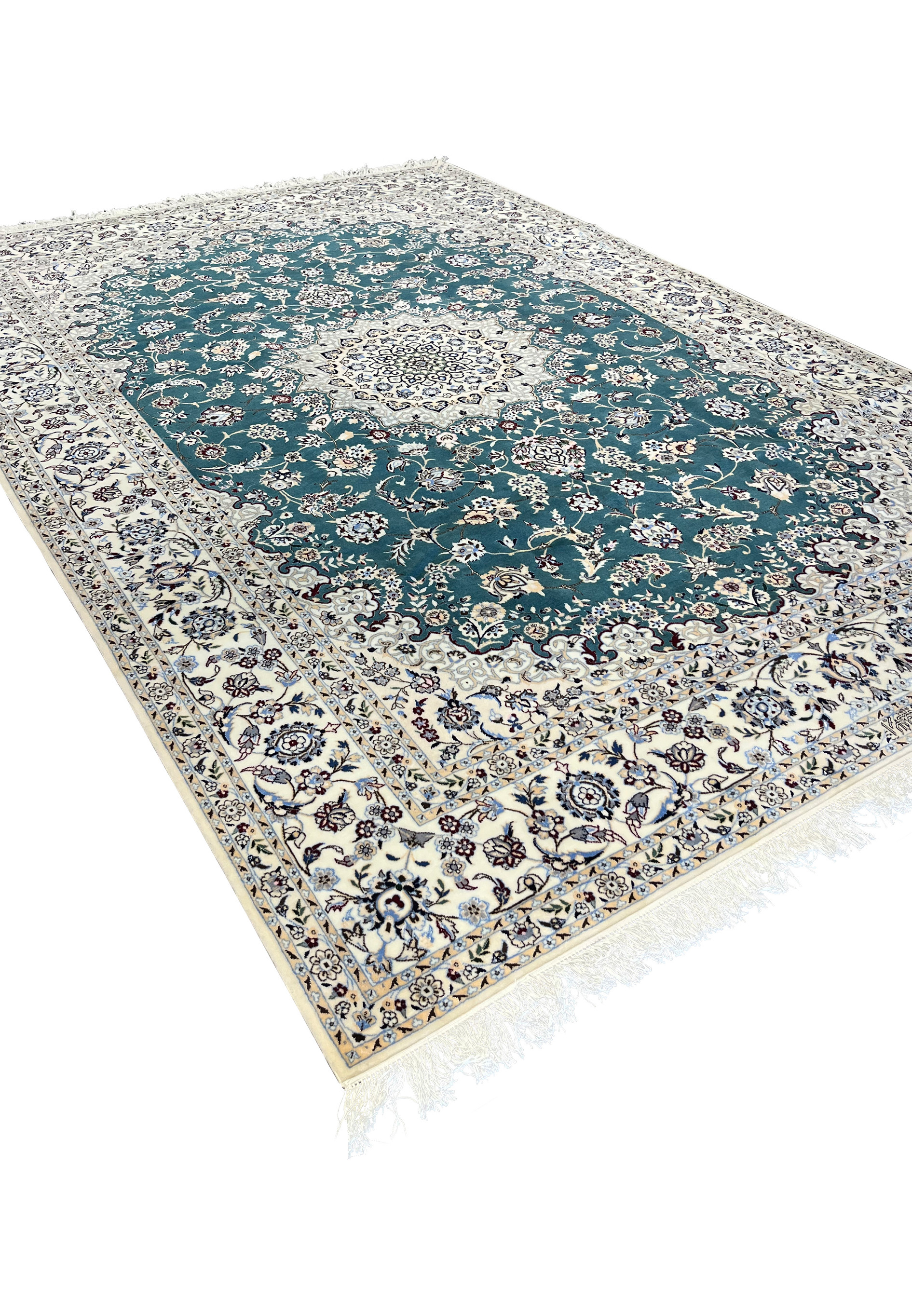 Angled view of 7x10 Persian Nain 6La Habibian teal rug showing wool silk pile depth and sheen