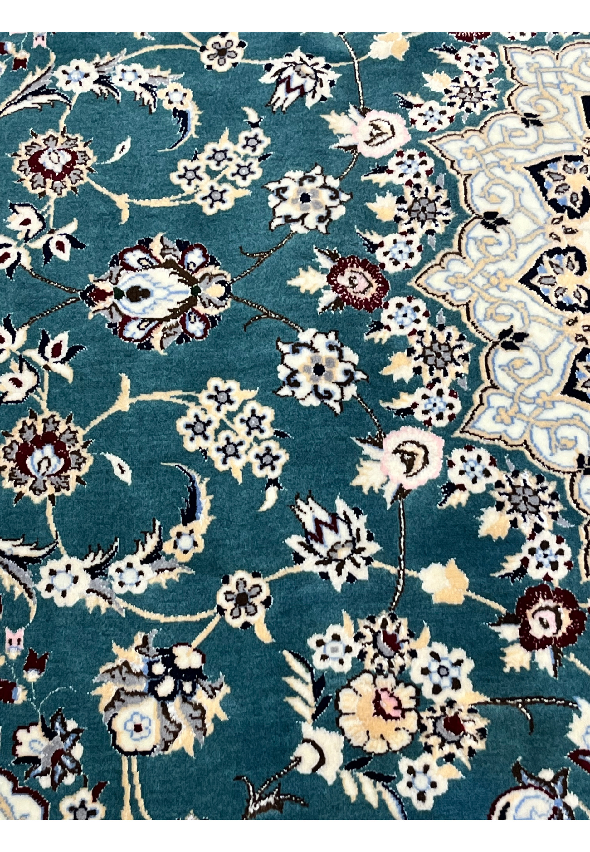 Color and motif detail of 7x10 Persian Nain 6La Habibian rug showing teal field silk accents
