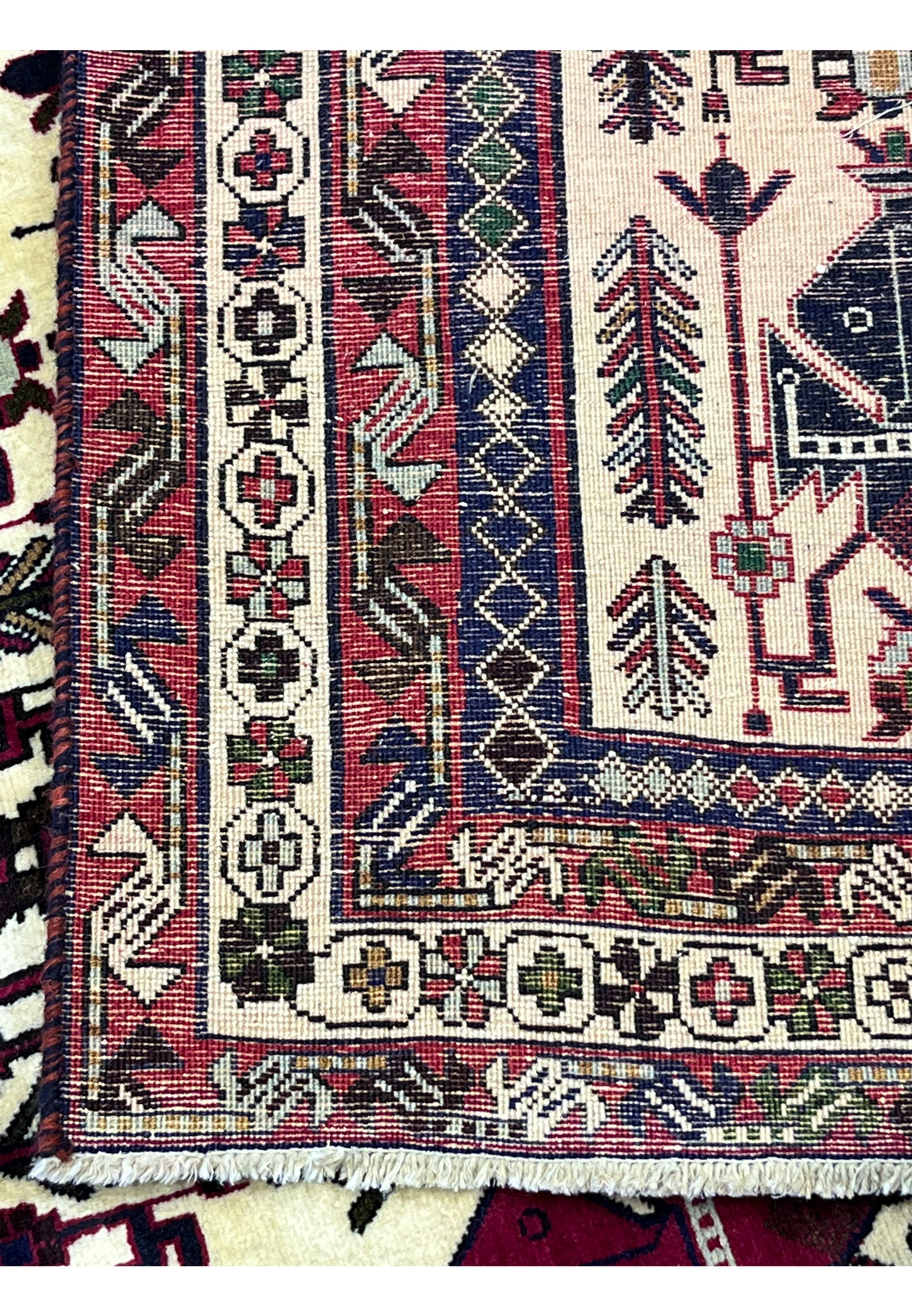 Back of 5x8 Persian Afshar tribal rug showing hand-knotted wool construction and knot density