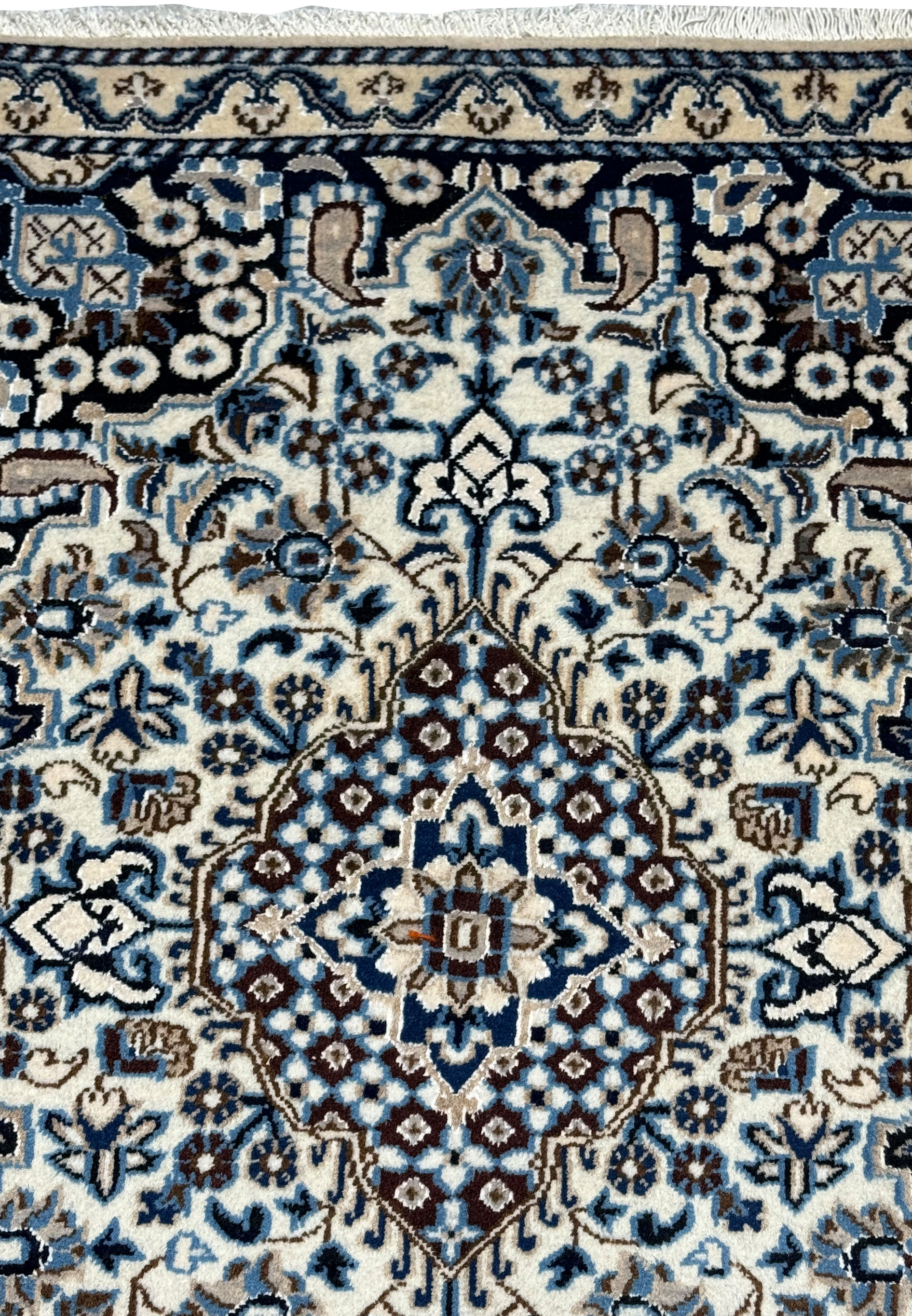 3x5 Persian Nain rug upper field ivory arabesque navy spandrel floral detail