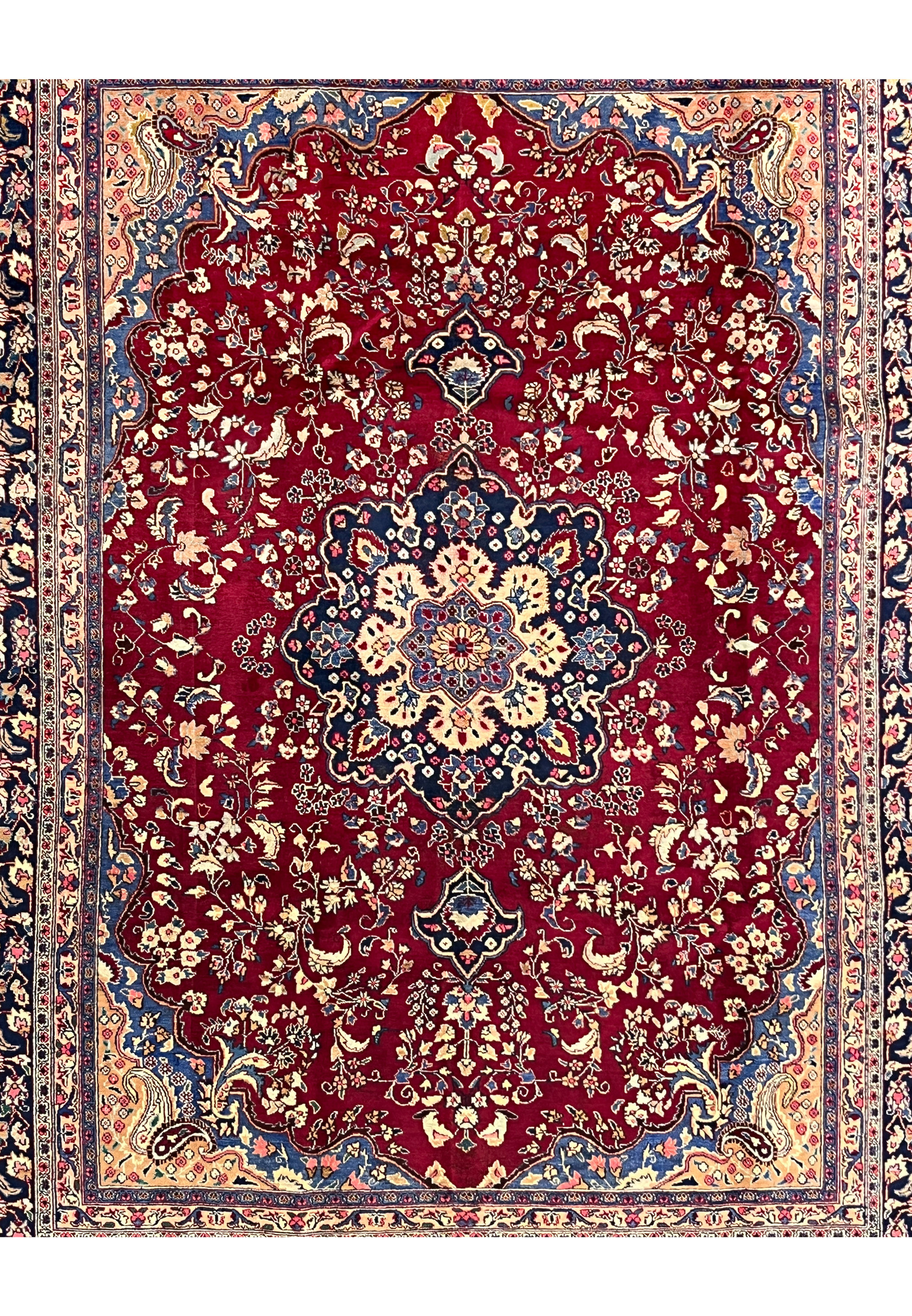 10x13 distressed antique Persian Mashad rug midfield red ground navy medallion ivory florals