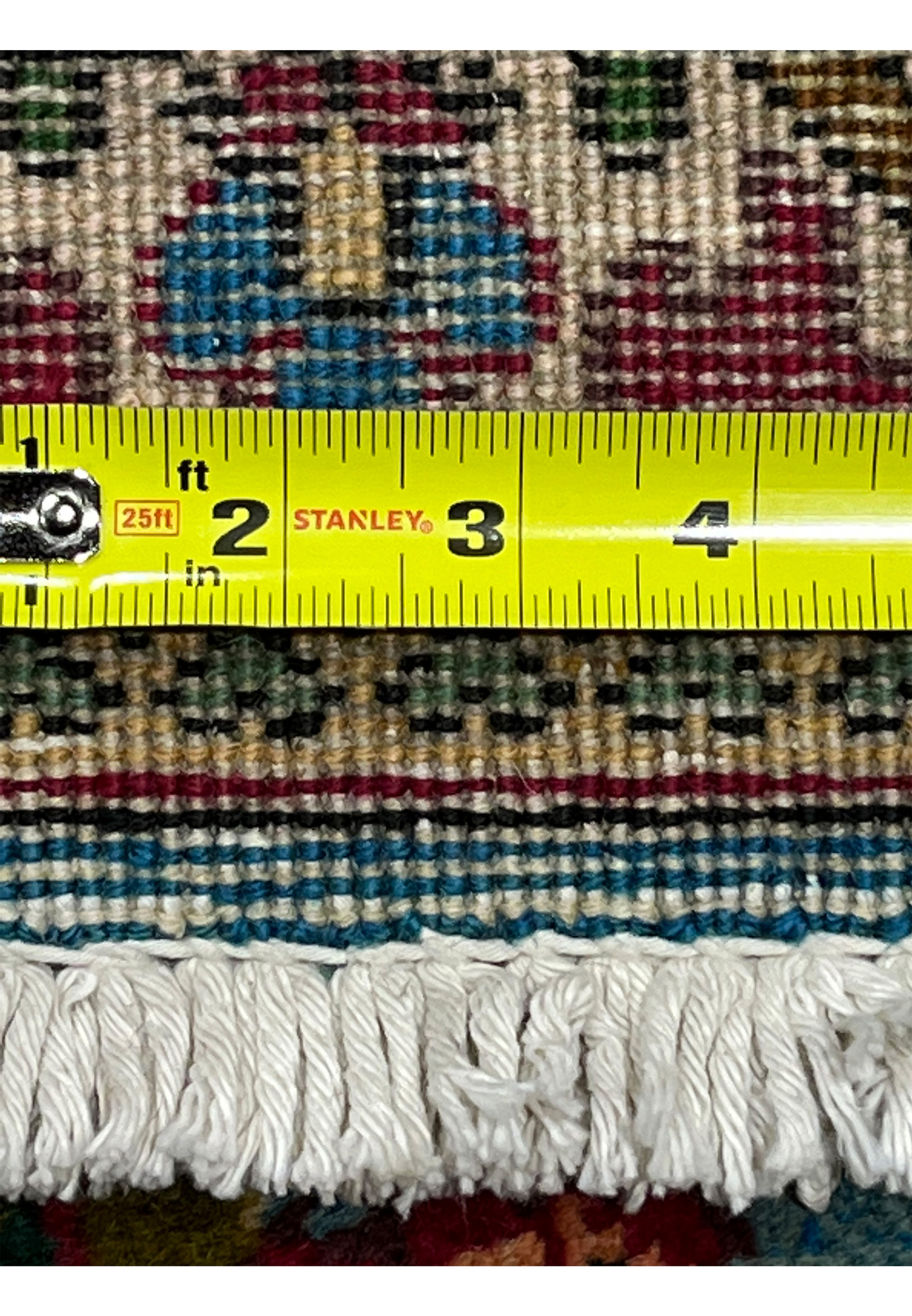 Back knot closeup of 10x13 Persian Tabriz rug with ruler showing approximately 240 to 260 KPSI