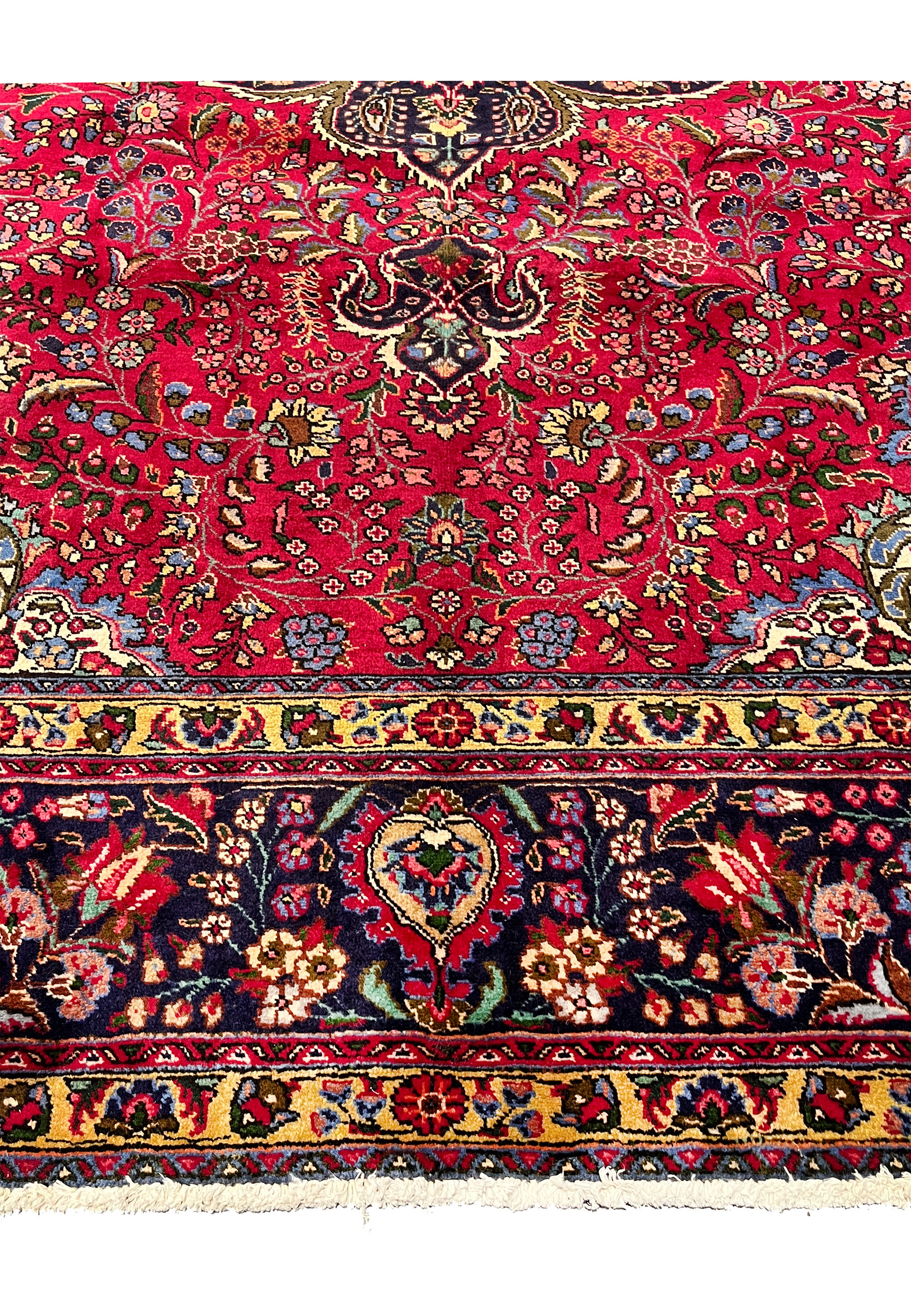 Lower border of 10x13 Persian Tabriz rug, floral vine with rosettes on navy ground