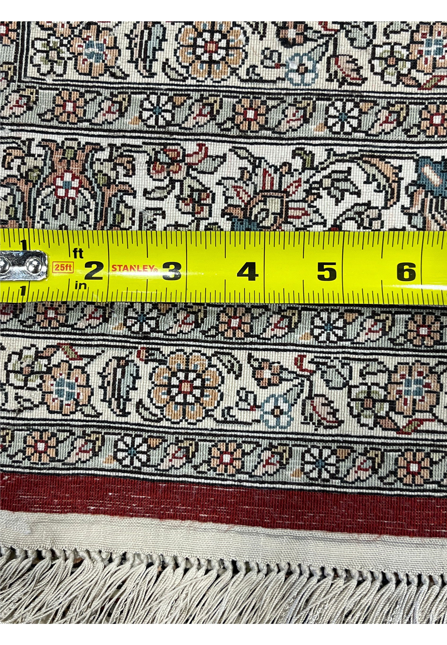 Knot density measurement with ruler confirming 780 to 800 KPSI on this handmade Turkish silk rug