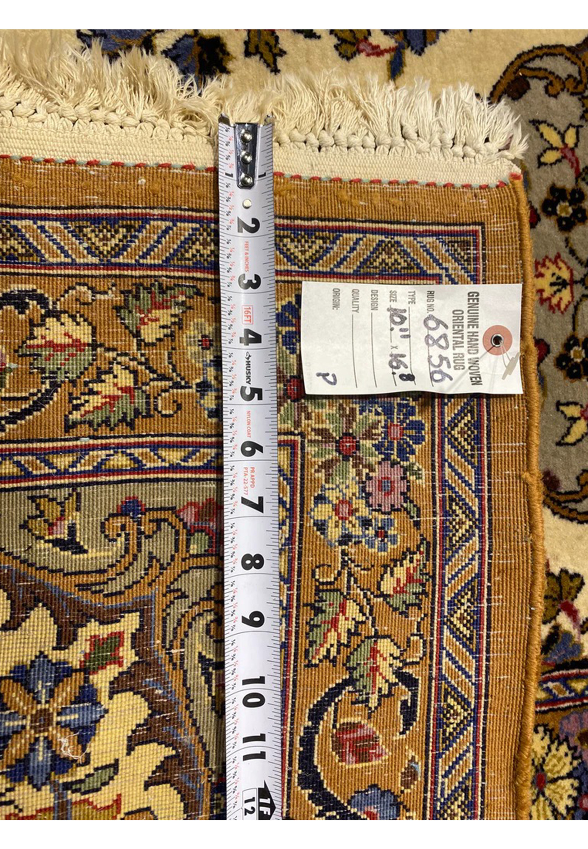 Backside ruler measurement confirming approximately 320 to 340 KPSI on this Persian Qum Kork rug