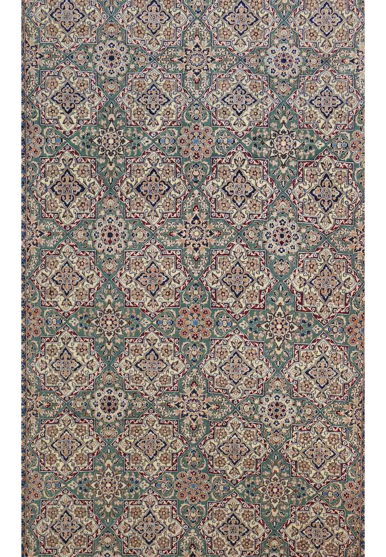 Close-up view of intricate floral designs on the 7 x 10 Persian Nain 6 LAA Habibian rug
