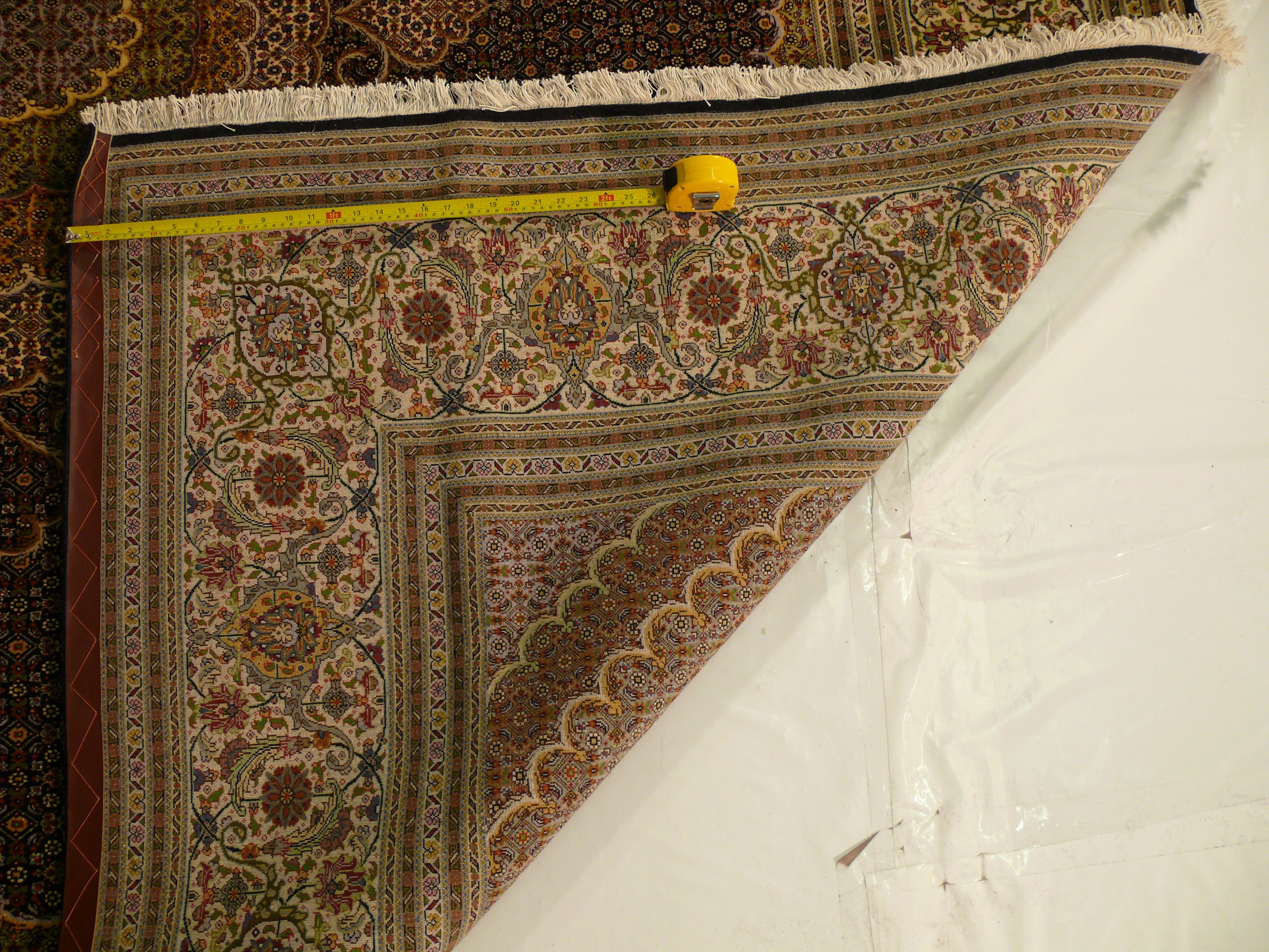 Experience the unparalleled beauty of our Persian Tabriz Rug with Mahi Design, featuring intricate detailing and expert craftsmanship