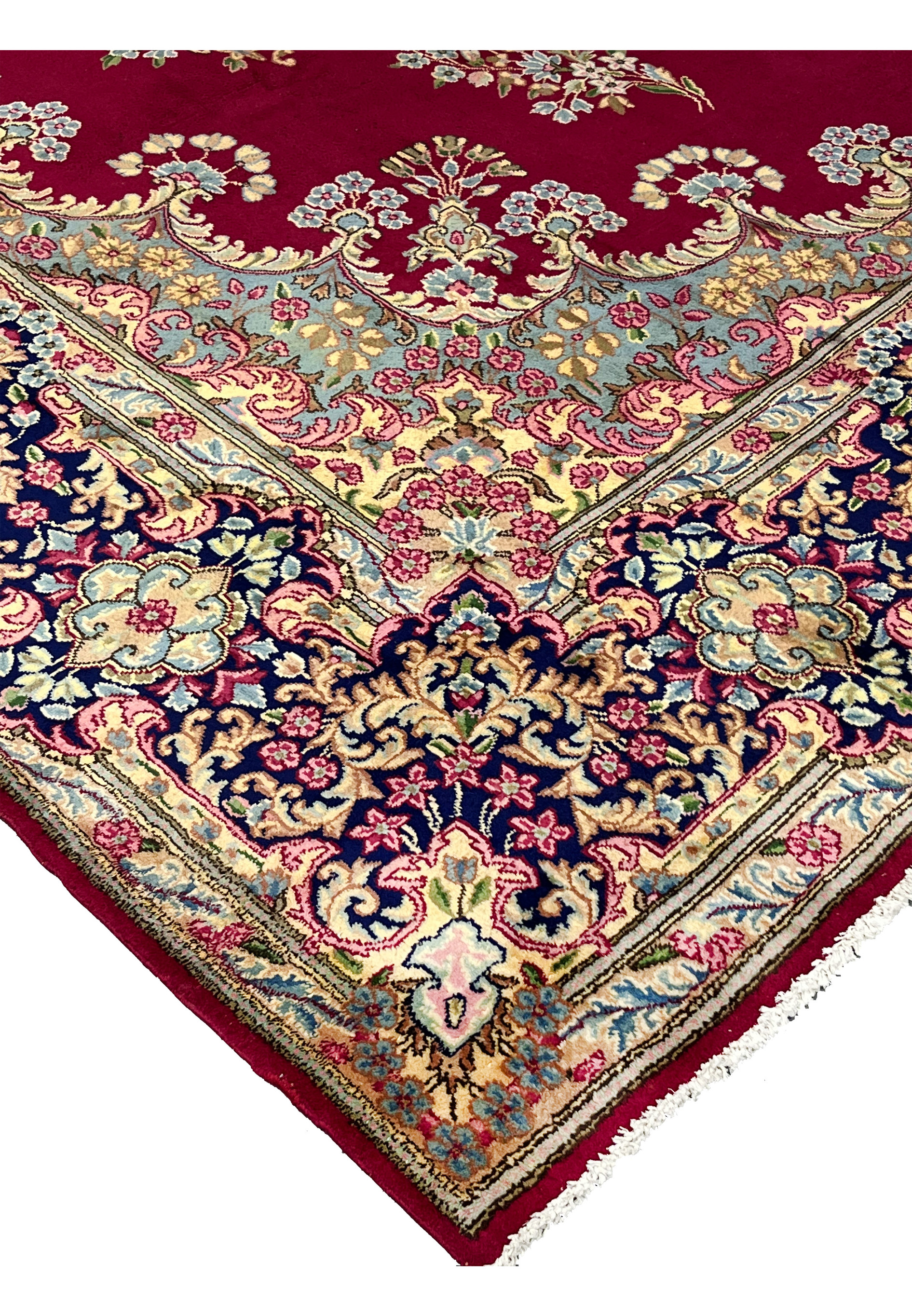 10x14 Persian Kerman rug corner edge crimson red navy border ivory fringe detail