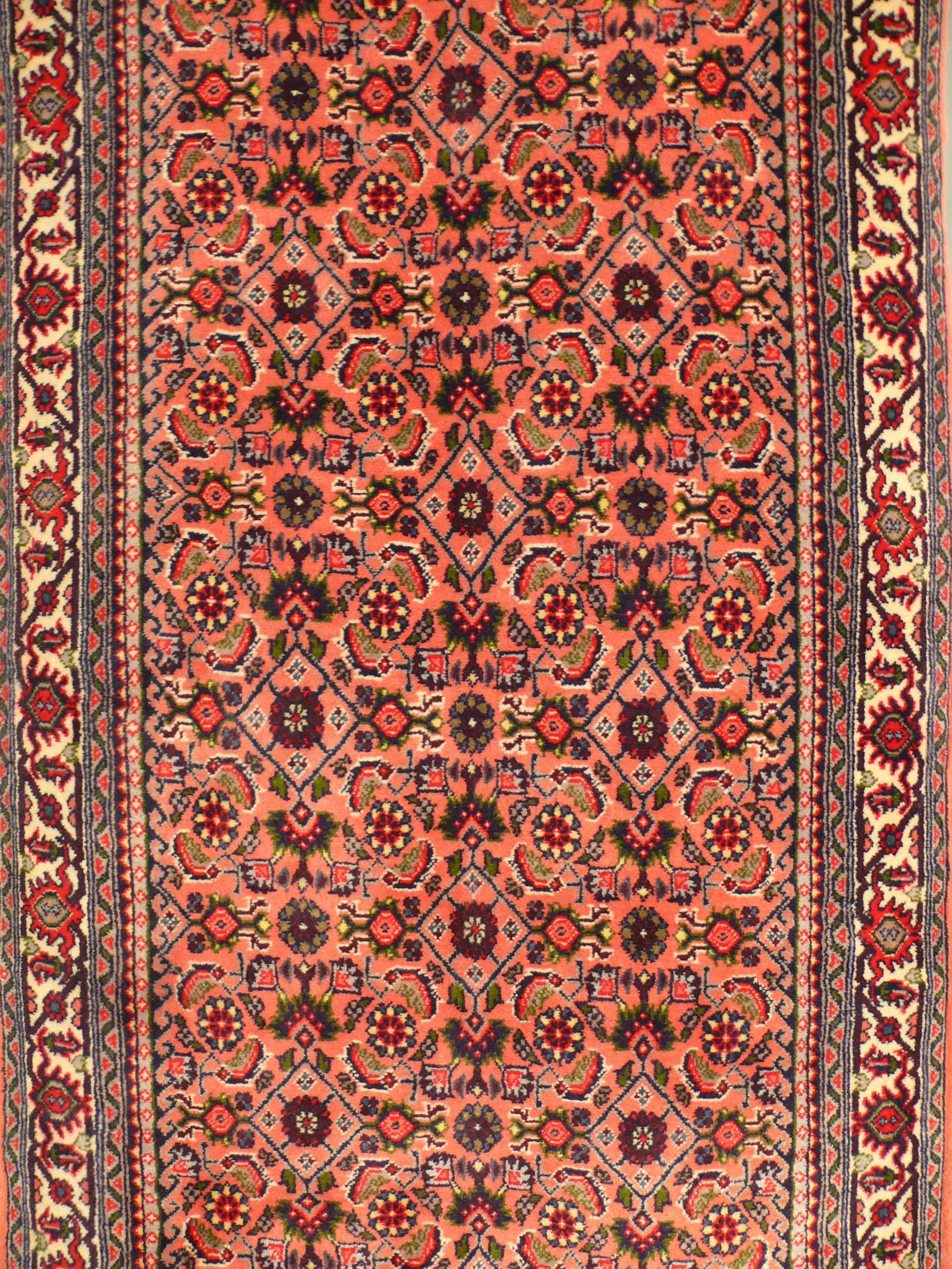 Close-up detail of the intricate patterns and knot density on the Persian Bijar Runner Rug.