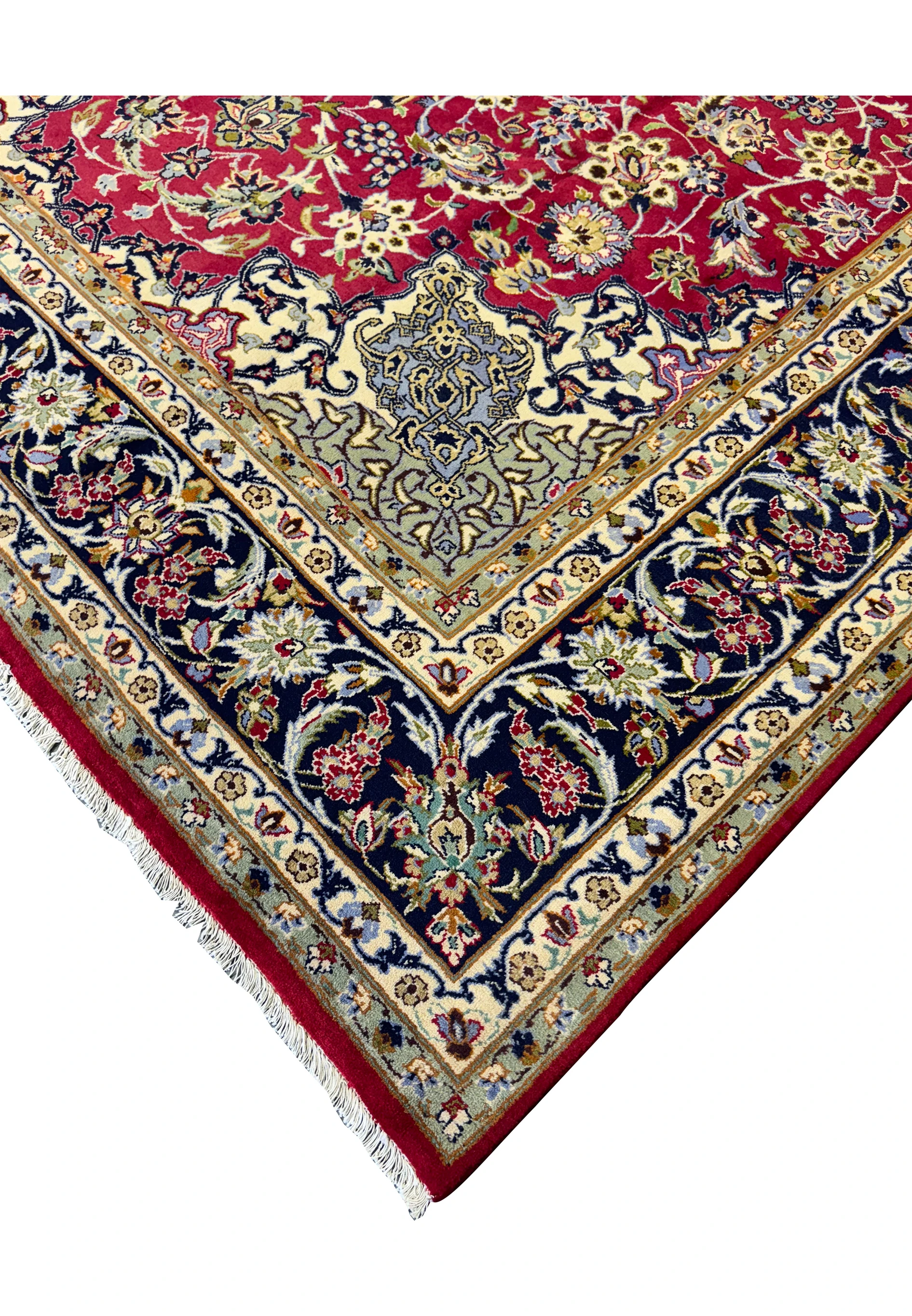 Edge detail of Persian Isfahan Rug displaying the luxurious wool pile and cotton foundation.