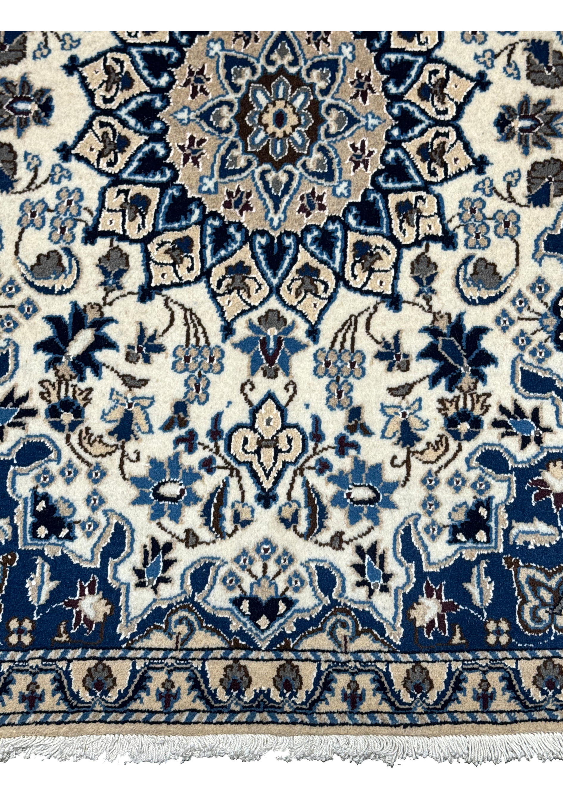 Lower part of Persian Nain rug with detailed floral and vine motifs.