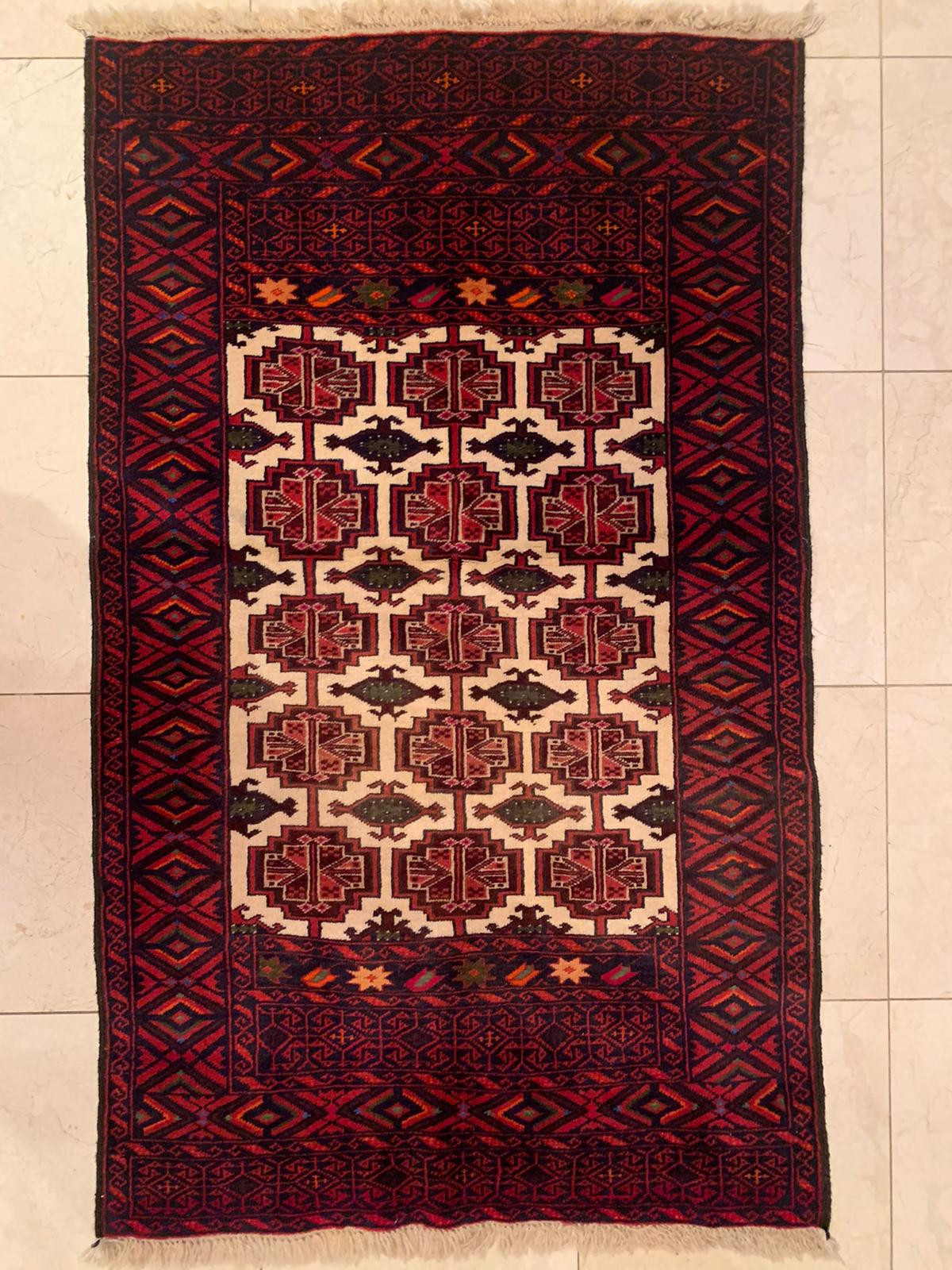 Handwoven wool texture of the 3 x 5 Persian Baluch Prayer rug