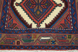Detailed shot of the Persian Hamedan Runner Rug's intricate design, showcasing the fine craftsmanship and rich, vibrant colors. This close-up highlights the attention to detail that goes into each handmade piece.