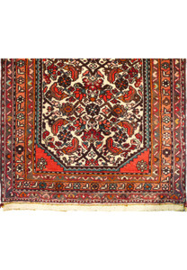 Detail of the rug’s edge, highlighting the craftsmanship of the handwoven wool.