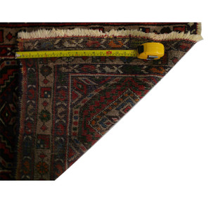 Backside view of the 2'3" x 3'9" Semi Antique Persian Enjlas Rug with a ruler on it, demonstrating the high knot density and craftsmanship