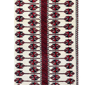 Intricate details of the Persian Baluch rug captured in a close-up shot, highlighting the unique beauty of its design