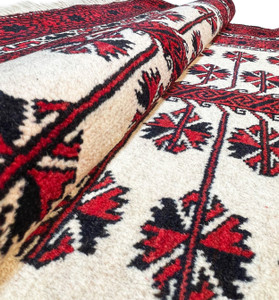 Close-up of the high-quality wool used to create the Persian Baluch rug, showcasing its fine texture and durability.