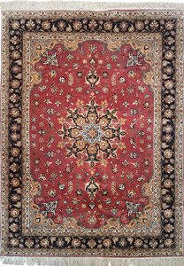 Elegant 5x7 Persian Tabriz Rug with Salmon and Navy Blue Hues on Display