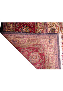 Handwoven Persian Mashad rug, 11'3" x 14'5", highlighting traditional design elements in a spectrum of navy, red, and gold