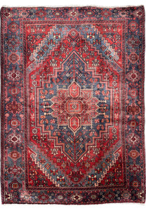 Full view of a vintage Persian Bijar rug showcasing intricate geometric patterns with a dominant central medallion, set against a deep red and navy blue color scheme