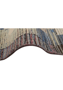 Close-up of the rug, showing the intricate weave and color transition, giving a sense of the rug's handcrafted quality.